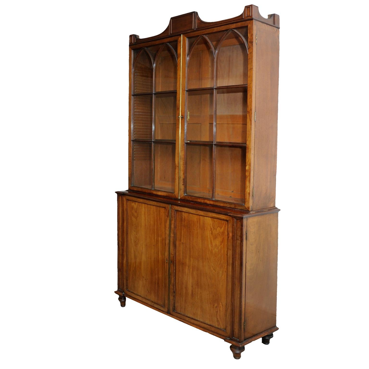 This is a superb English George III mahogany satinwood and purple heart glazed bookcase of unusually shallow proportions and highly workable. Attributed to Gillows of Lancaster, circa 1780. 

Full measurements:
Height 229cm (90