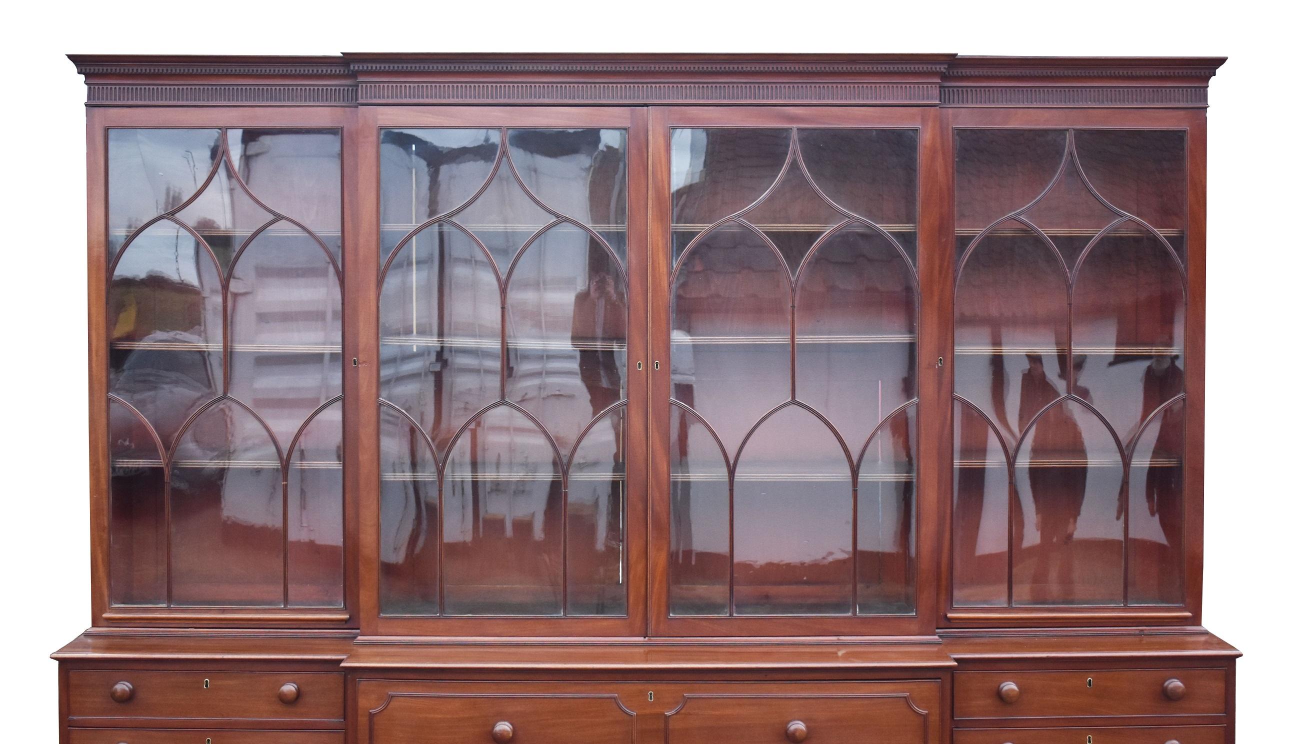 For sale is a fine quality George III Mahogany secretaire breakfront bookcase. Have four doors with arched oval glazing bars open to adjustable interior shelves. Below this, the base has a large secretaire drawer to the centre, with a drop front