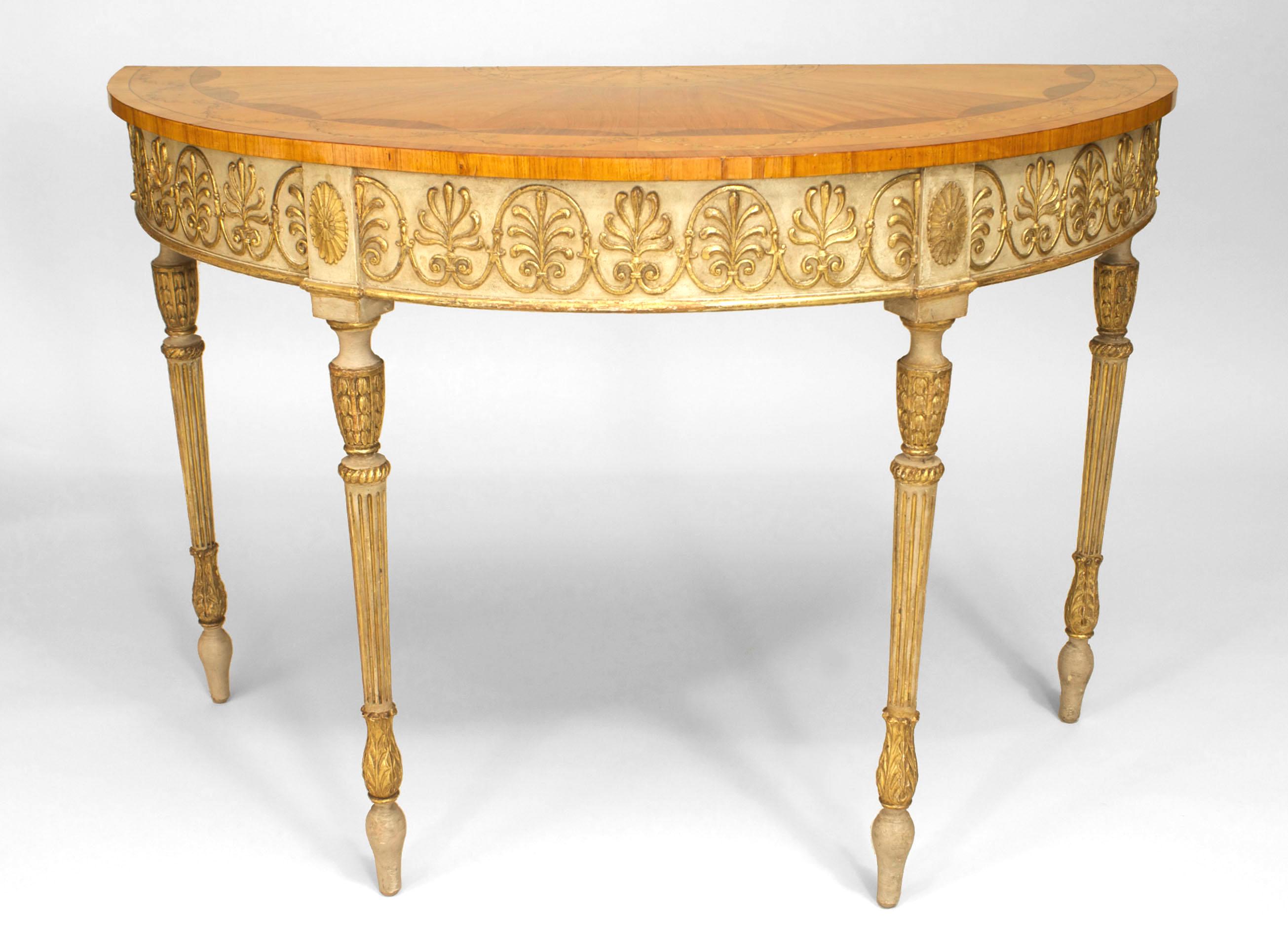 English George III (circa 1780) cream painted and parcel-gilt carved and trimmed demilune console table with a satinwood and inlaid top having a festoon and sunburst design. (Manner of Robert Adam)
