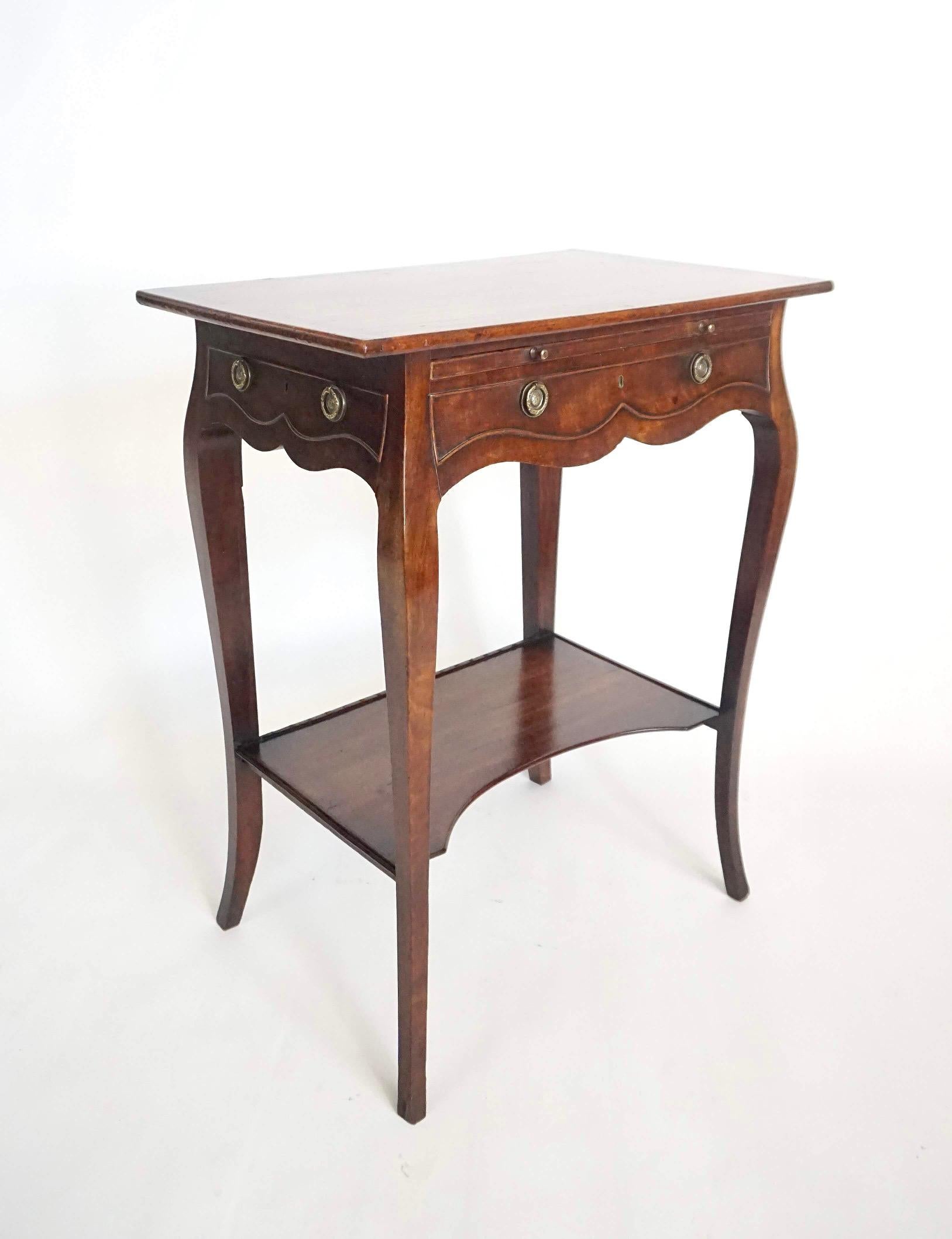 A English circa 1770 early George III period sabicu and gonçalo alves lady's writing or work table in the 'French' or rococo style of John Cobb and Pierre Langlois, the rectangular top above a felted brushing slide with brass knob pulls and faux