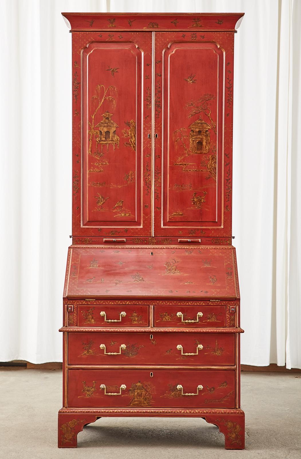 Grand English Geoge III style secretaire bookcase constructed by one of the finest furniture makers in the country Burton-Ching LTD in San Francisco, CA. The two part case features a dark red lacquered ground embellished with chinoiserie revival