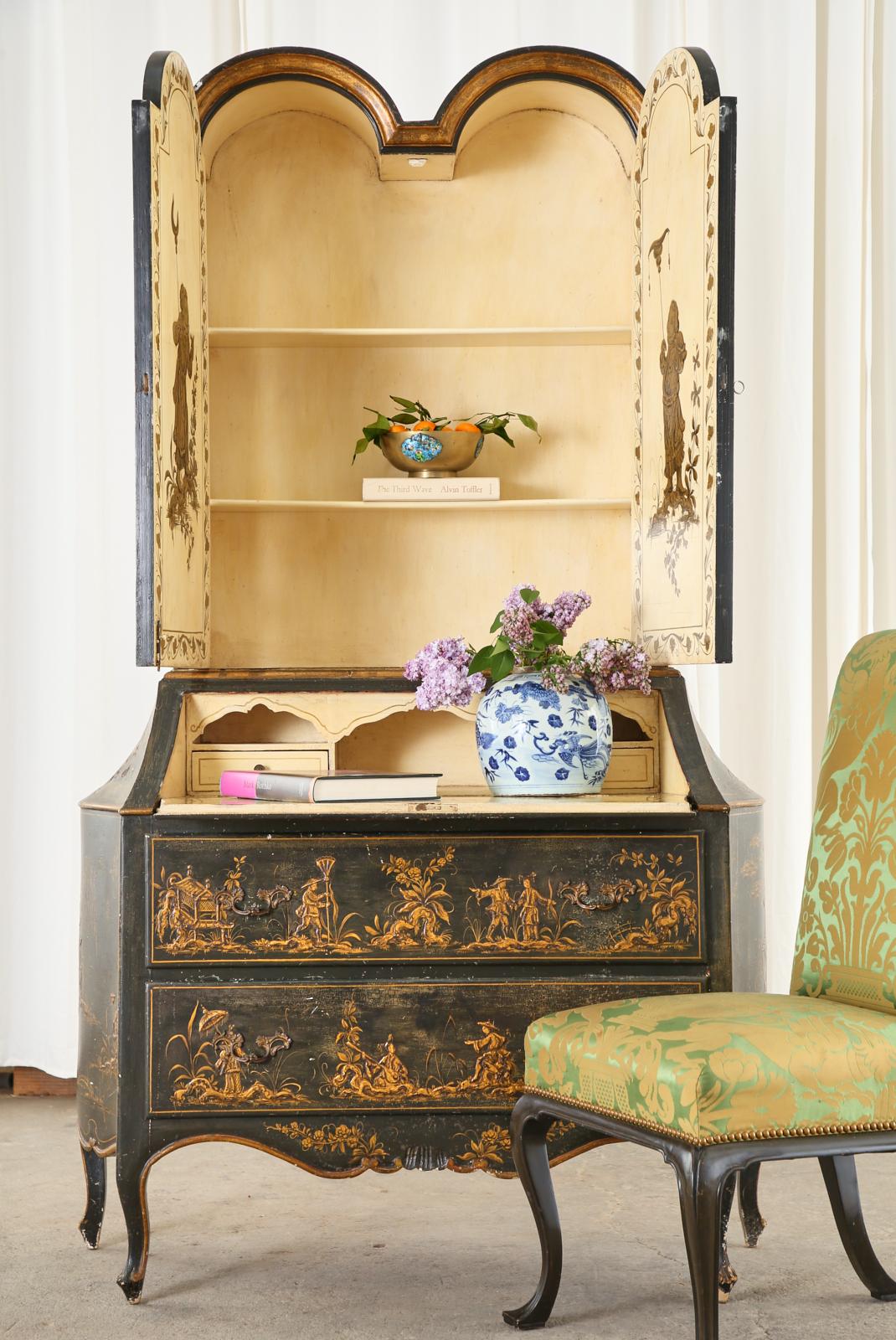 Stunning Italian Chinoiserie secretary bookcase crafted in the English George III taste. Beautifully decorated in the Chinoiserie revival period of mid-19th century through early 20th century in Europe. The tall two-piece case features a dark green