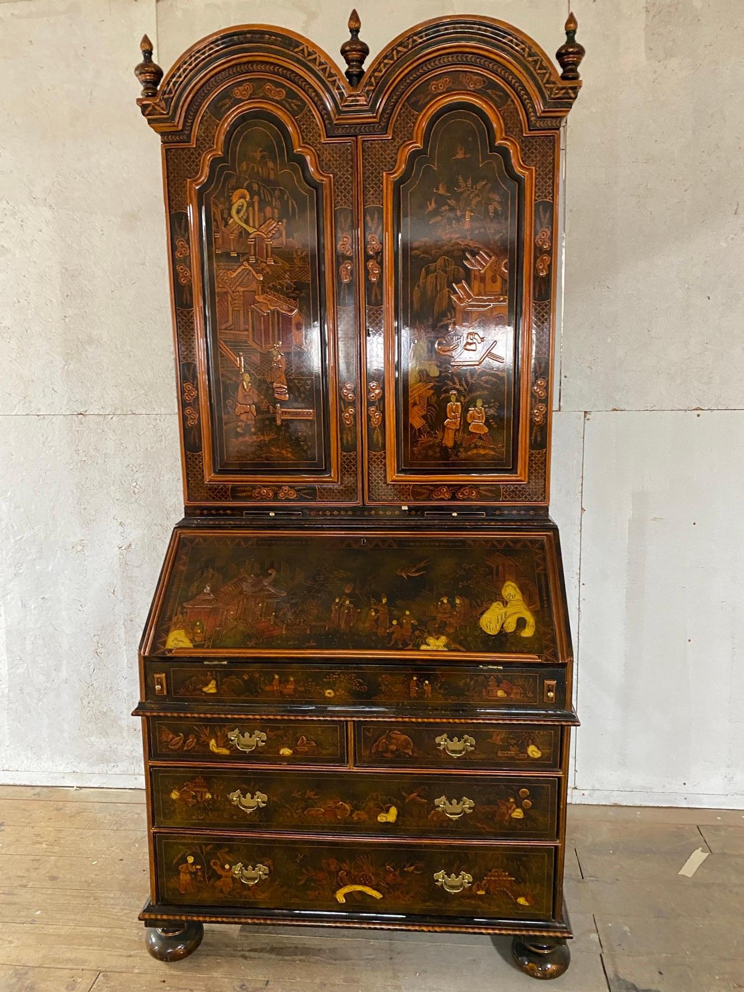 The two piece Chinoiserie Secretaire by Maitland-Smith features multiple drawers and compartments, double arched top and molded trim. The stunning bookcase crafted in the English George III style is beautifully decorated in the Chinoiserie revival