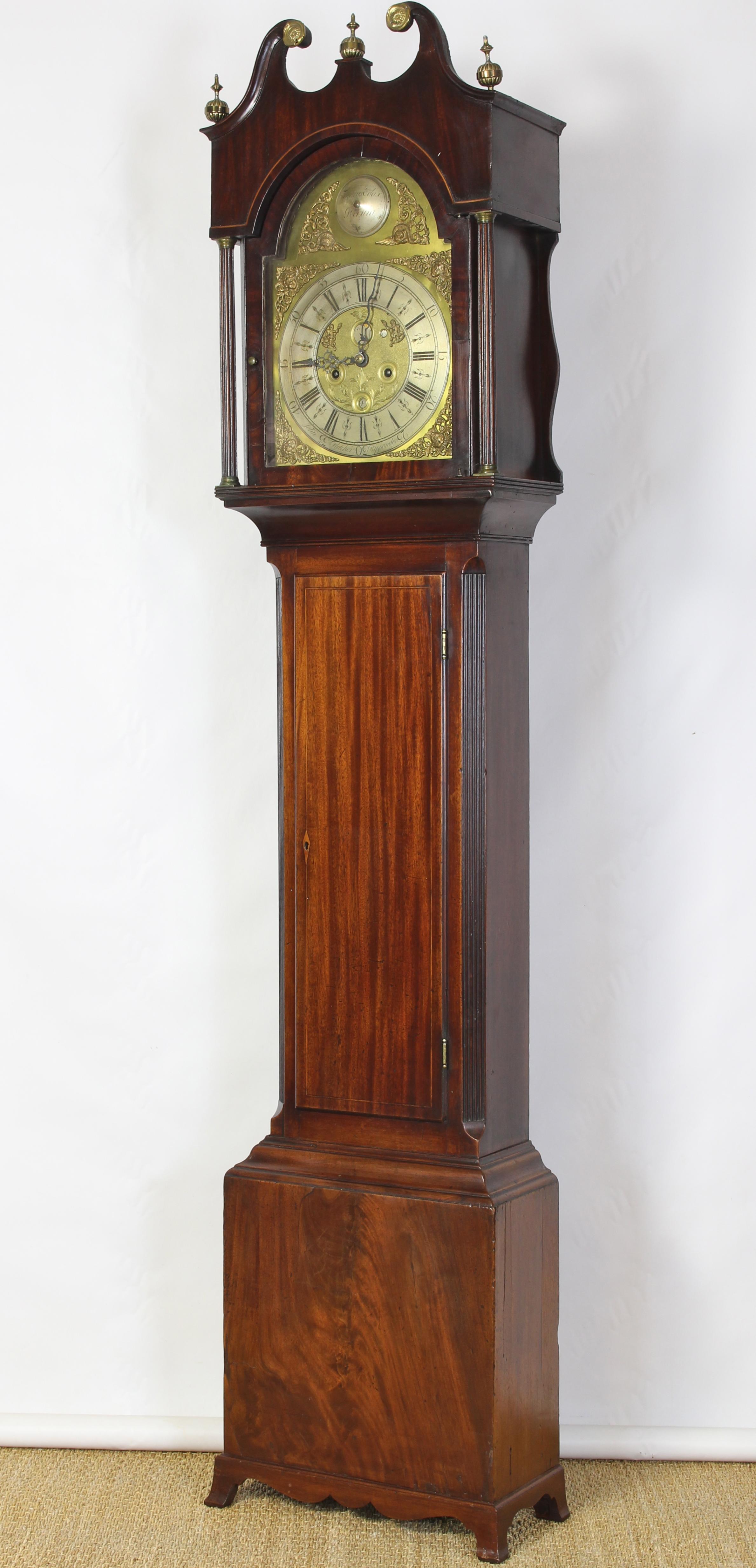 A late 18th century English mahogany tall case clock with elegant brass and silvered dial by John Fletcher of Ripponden. The clock features a complicated eight day movement indicating month and date and phases of the moon.
