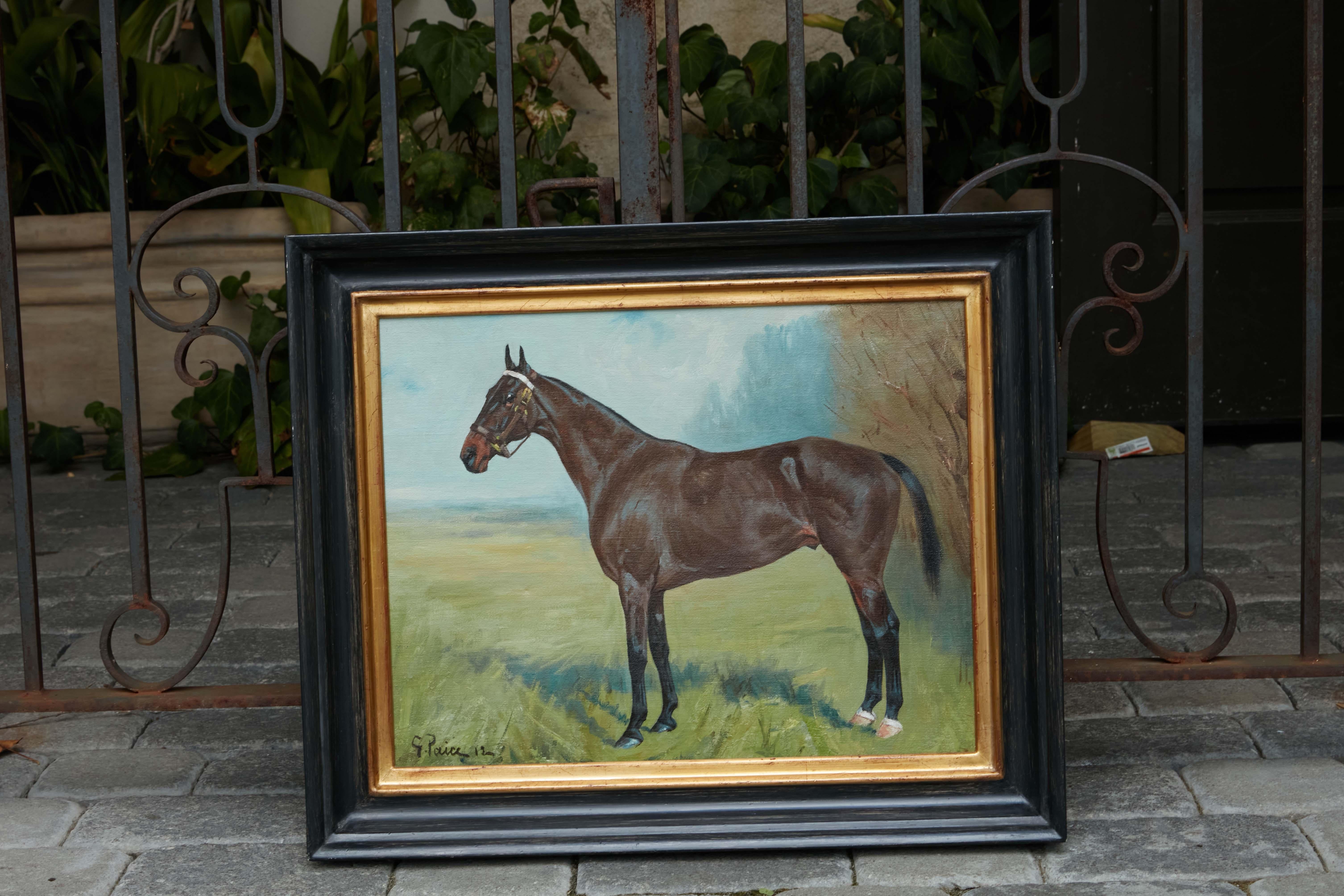 An English oil on canvas equestrian painting from the early 20th century signed George Paice (1854-1925), depicting a horse standing in a field, in a new custom black frame. Created in the early years of the 20th century by British painter George