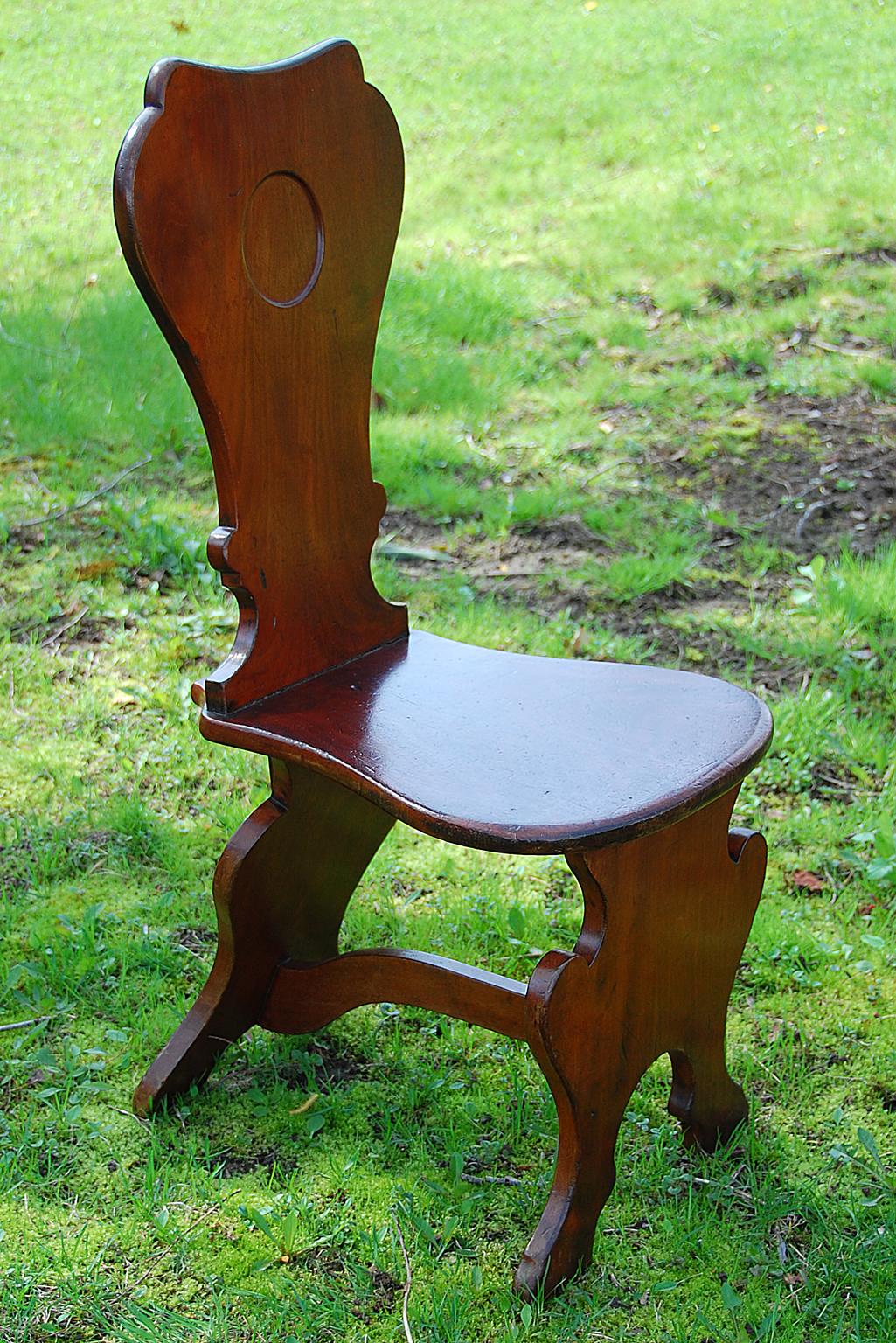English Georgian Chippendale period mahogany hall chair, circa 1770.