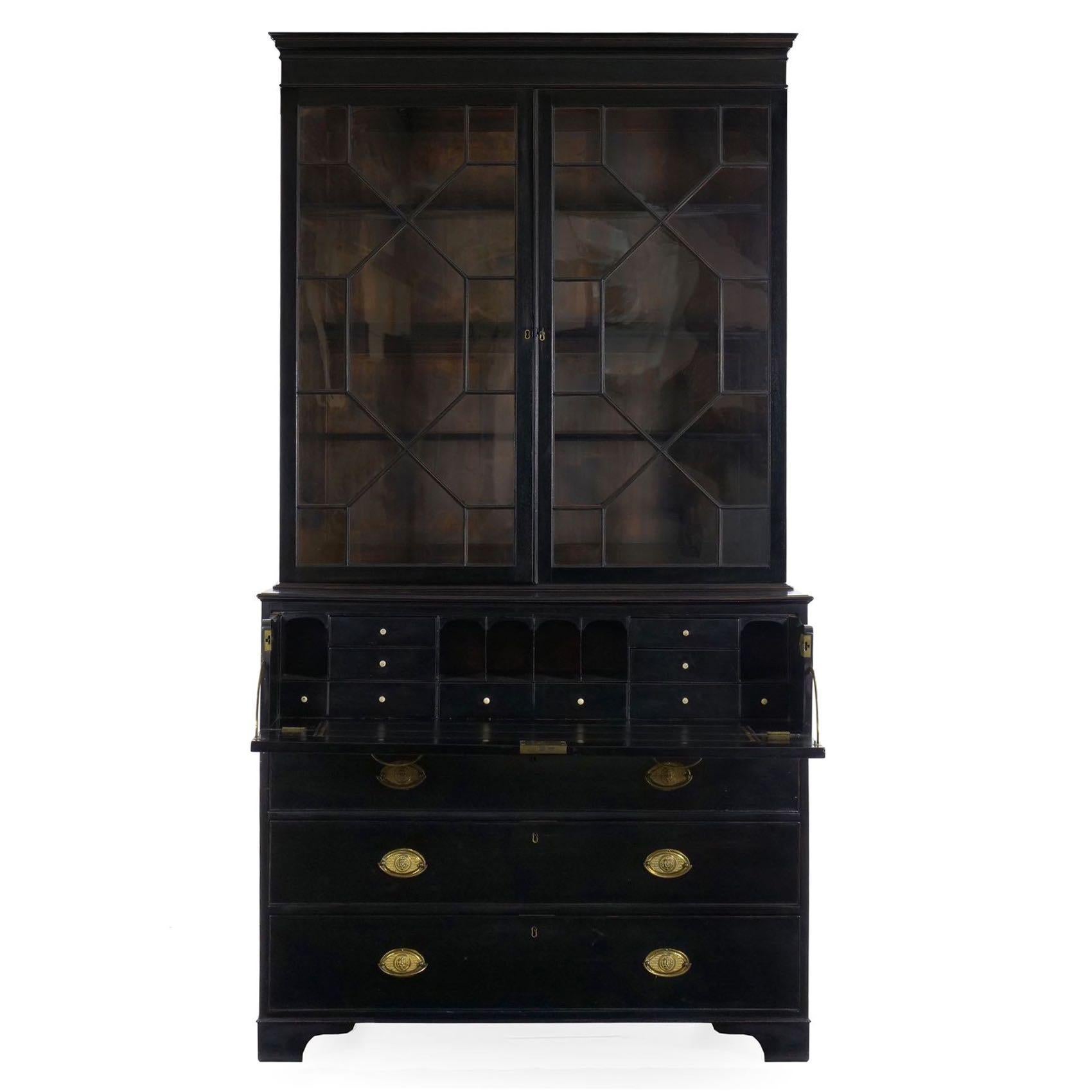 A finely crafted secretaire situated as a bookcase over a chest of drawers, the upper drawer is 