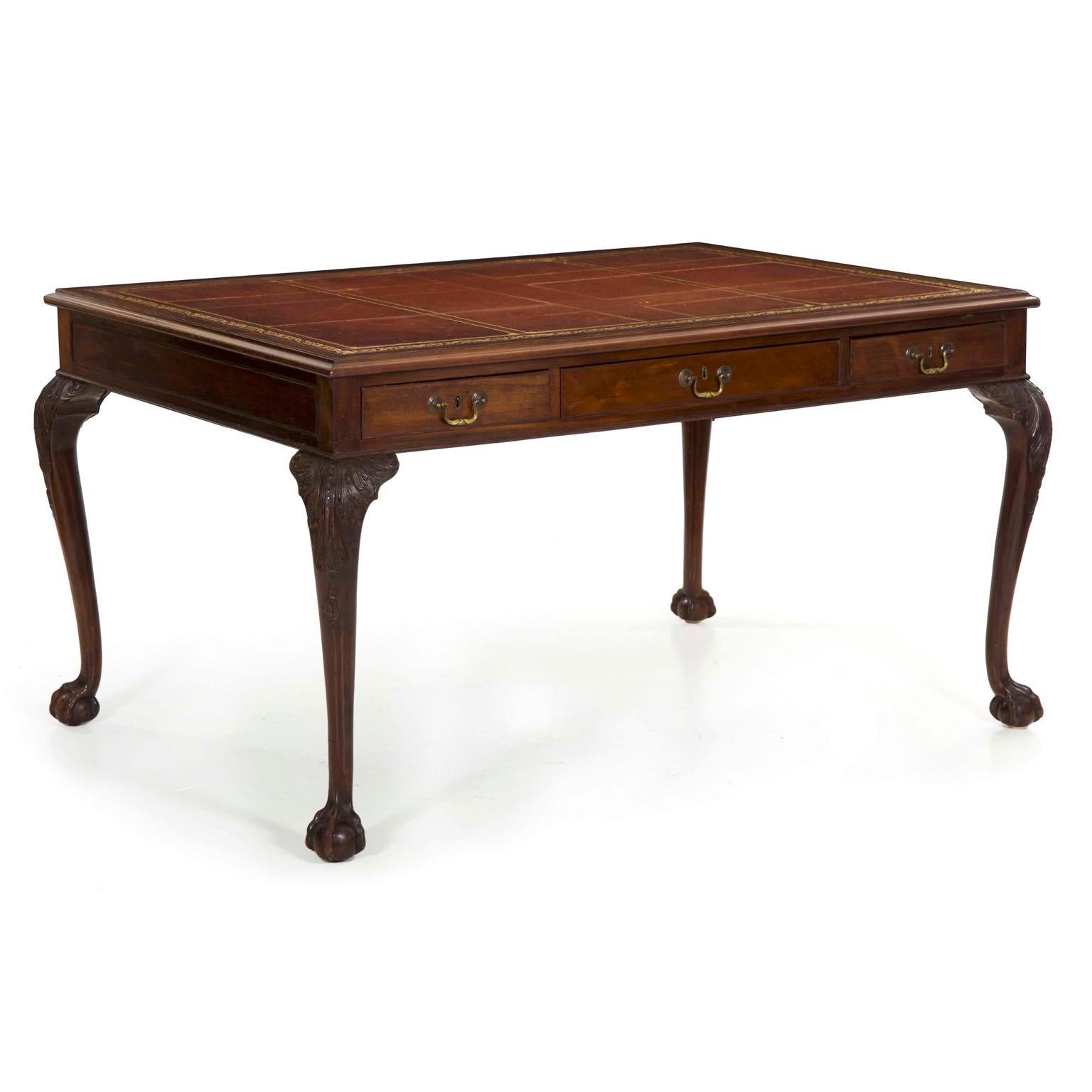 This is a very striking library table that is intended to be placed in a large study or library room where to people can work opposite one another. Both sides feature three drawers, one broad central drawer flanked by two more narrow drawers, each