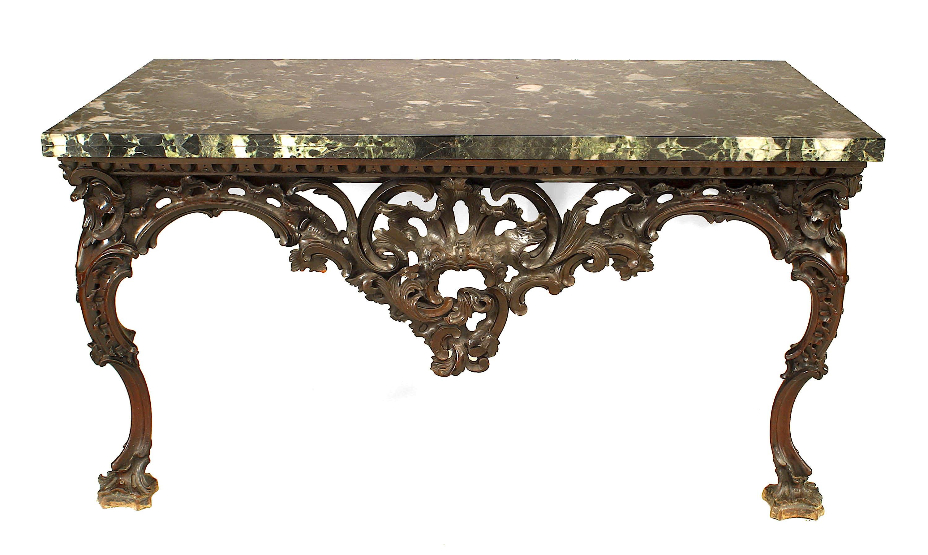 English Georgian (18th Century) mahogany bracket console table with a filigree floral and scroll carved apron and 2 front cabriole form legs supporting a green marble top.
