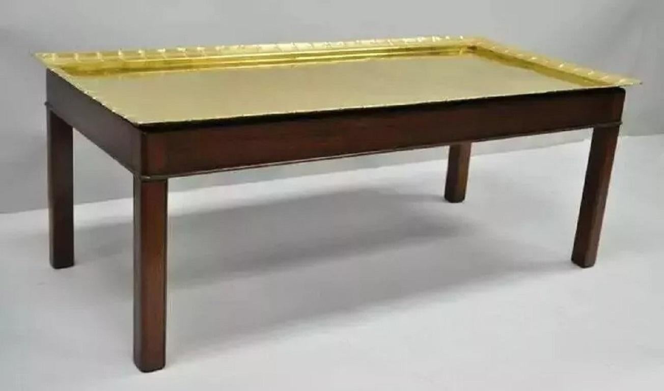 English Campaign Style Mahogany and Brass Tray Top Georgian Style Coffee Table. Item features a solid brass removable tray top with riveted iron supports to the underside, shapely scalloped edge, solid mahogany base with straight Marlborough style