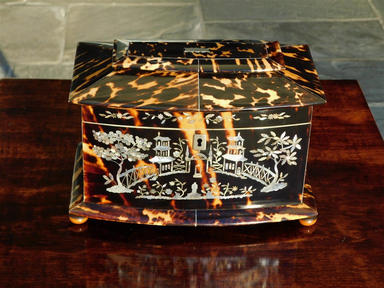 English Georgian Chinroserie bow front tortoise shell tea caddy with a hinged tiered lid, Chinese landscape mother of pearl inlays with flanking pagodas, fences, & foliage trees, central paktong plaque and escutcheon, bone fitted interior border