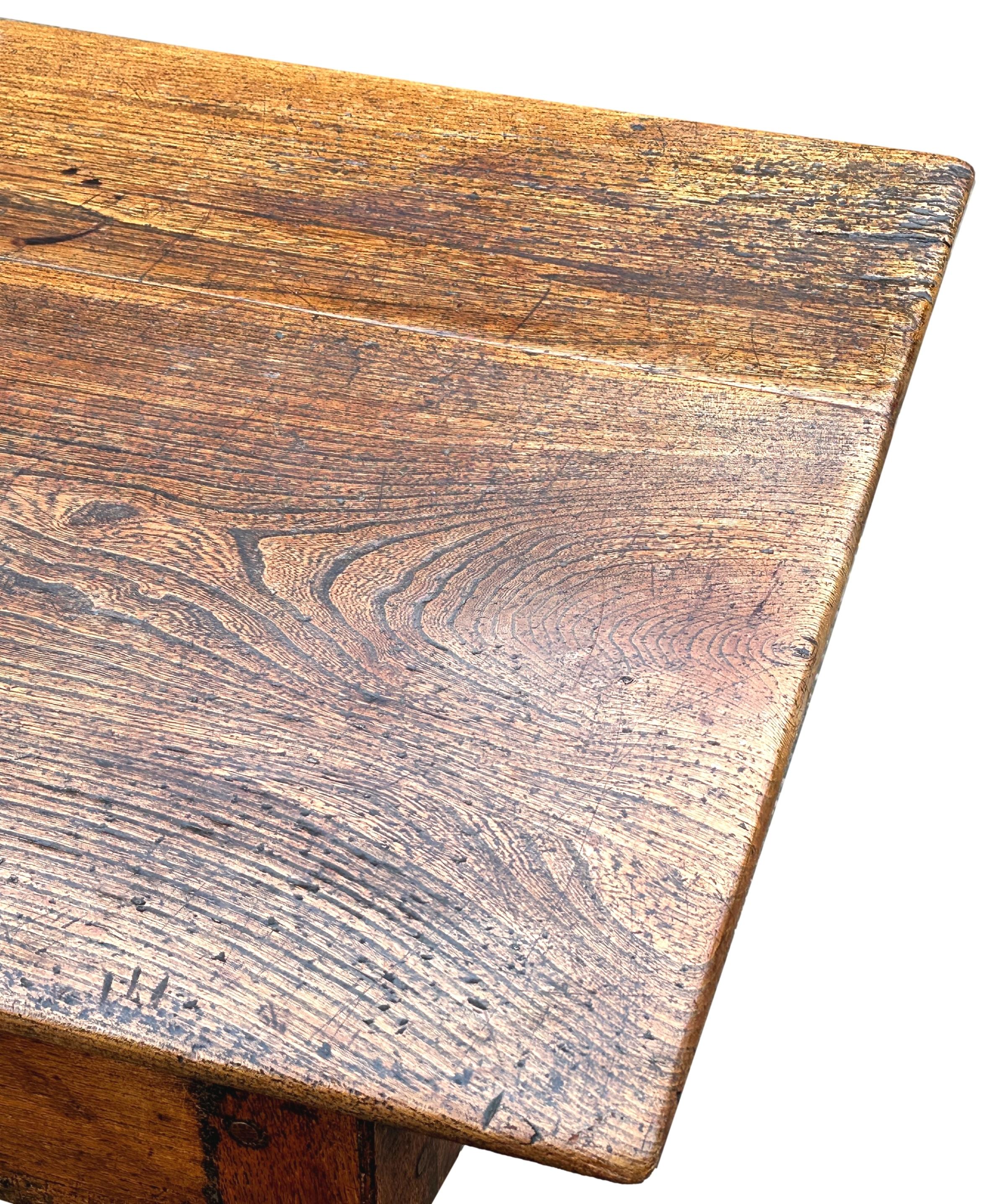 A Stunning And Rarely Found Genuinely 18th Century Georgian English Elm Farmhouse Kitchen Dining Table, Or Refectory Table, To Seat 8 Very Comfortably, Having Superbly Figured Plank Top Retaining Exceptional Untouched Colour And Patina, With One