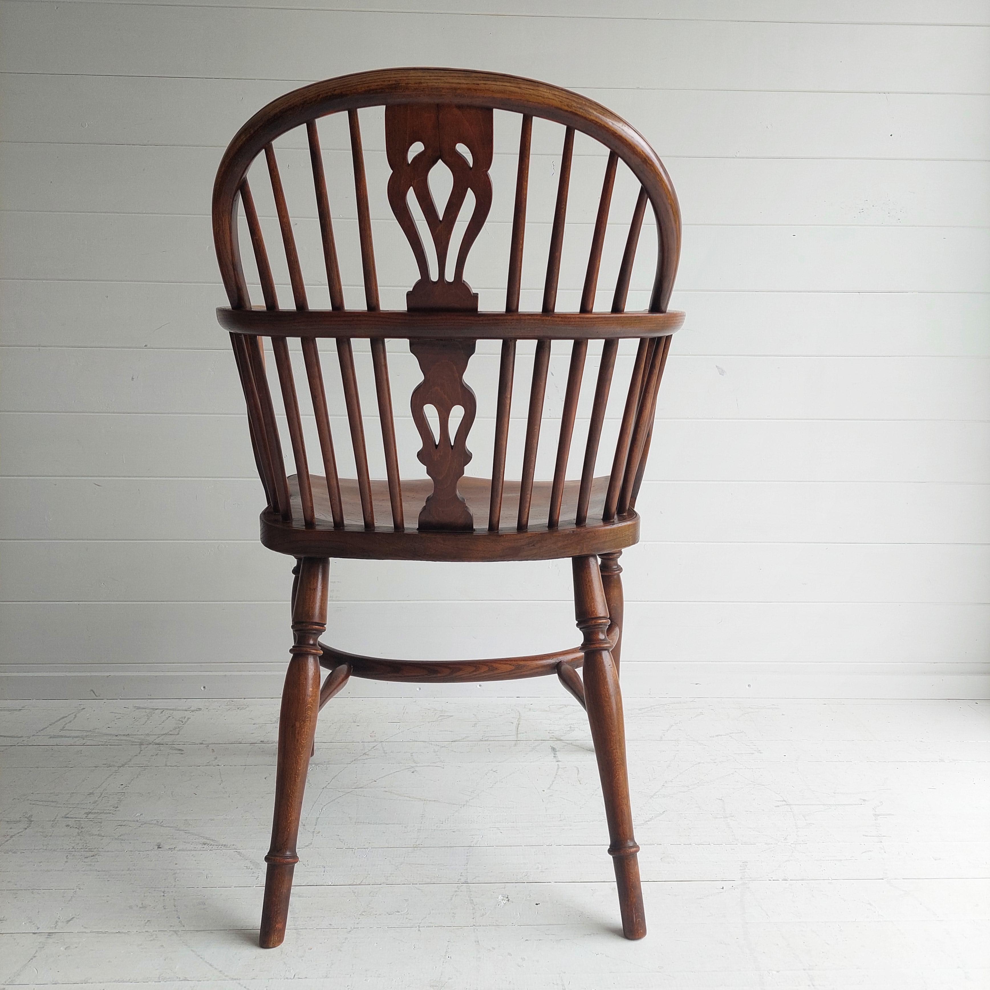 20th Century English Georgian Elm Windsor Armchair Double Bow Spindle Back, 1900s For Sale