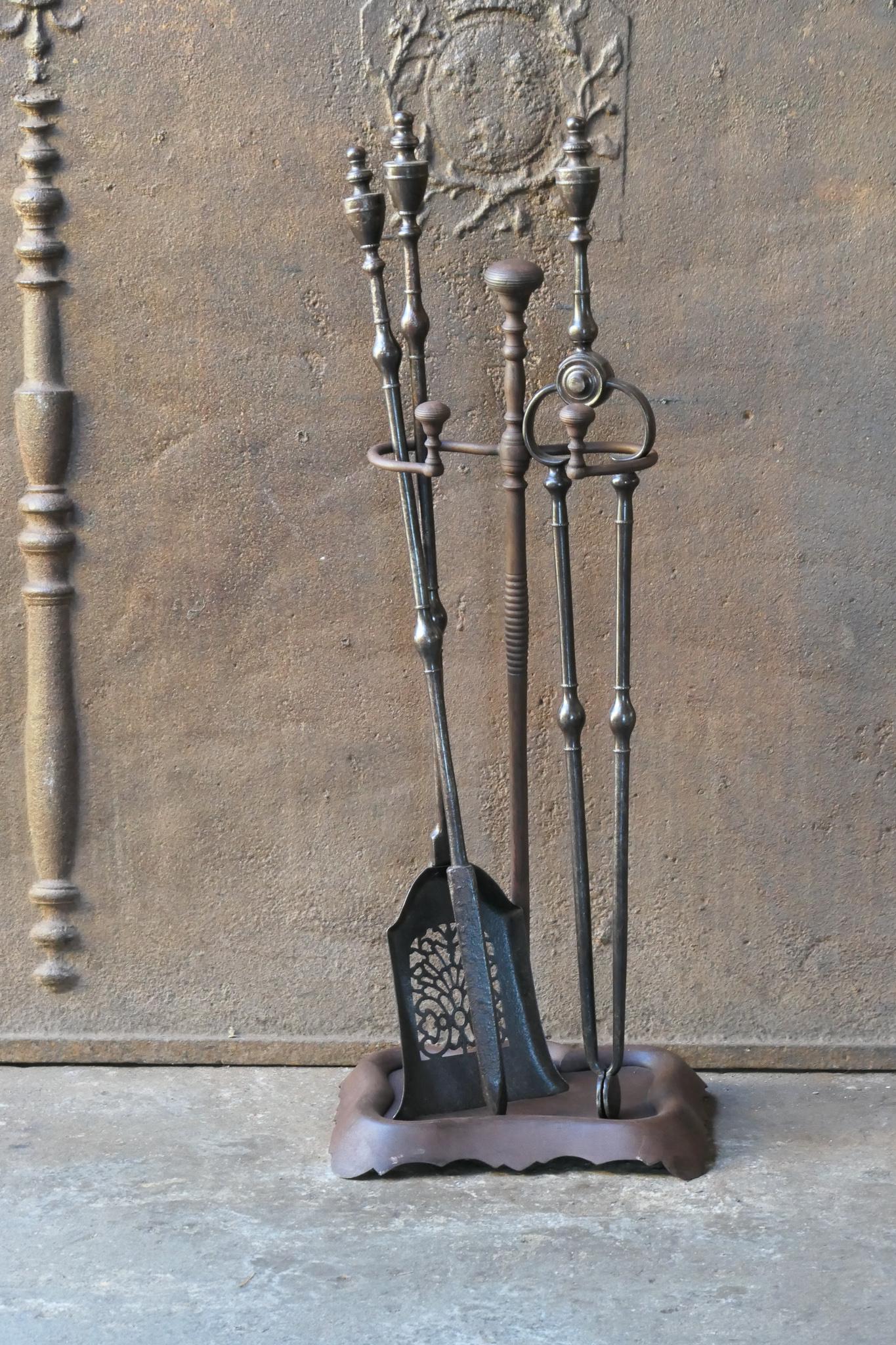 Set of three English Georgian fireplace tools and a stand made of wrought iron. Late 18th or early 19th century. The fire tool set is in a good condition and is fully functional.








 