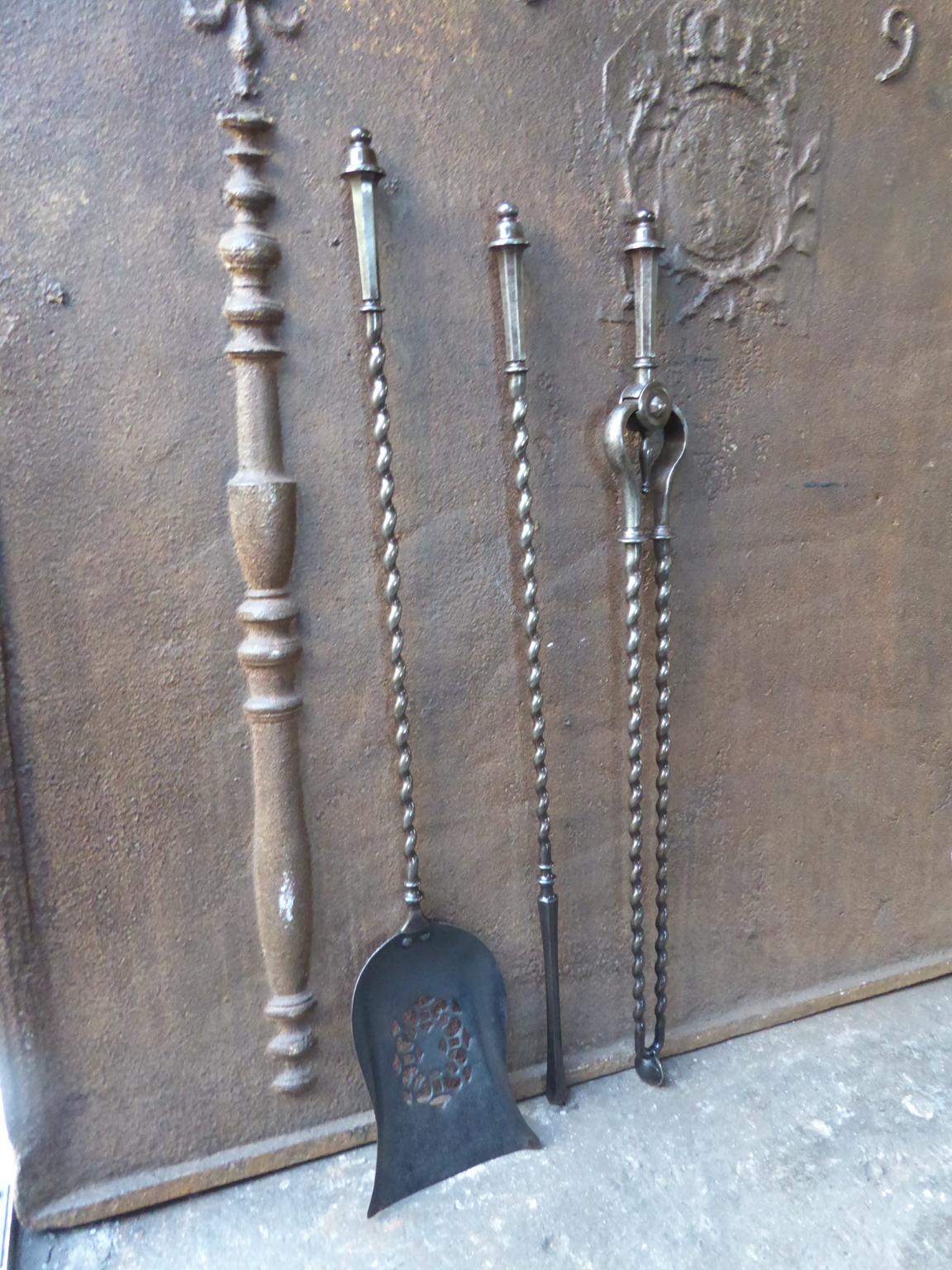 Set of three English Georgian fireplace tools made of wrought iron, 18th-19th century. The fire tool set is in a good condition and is fully functional.








    