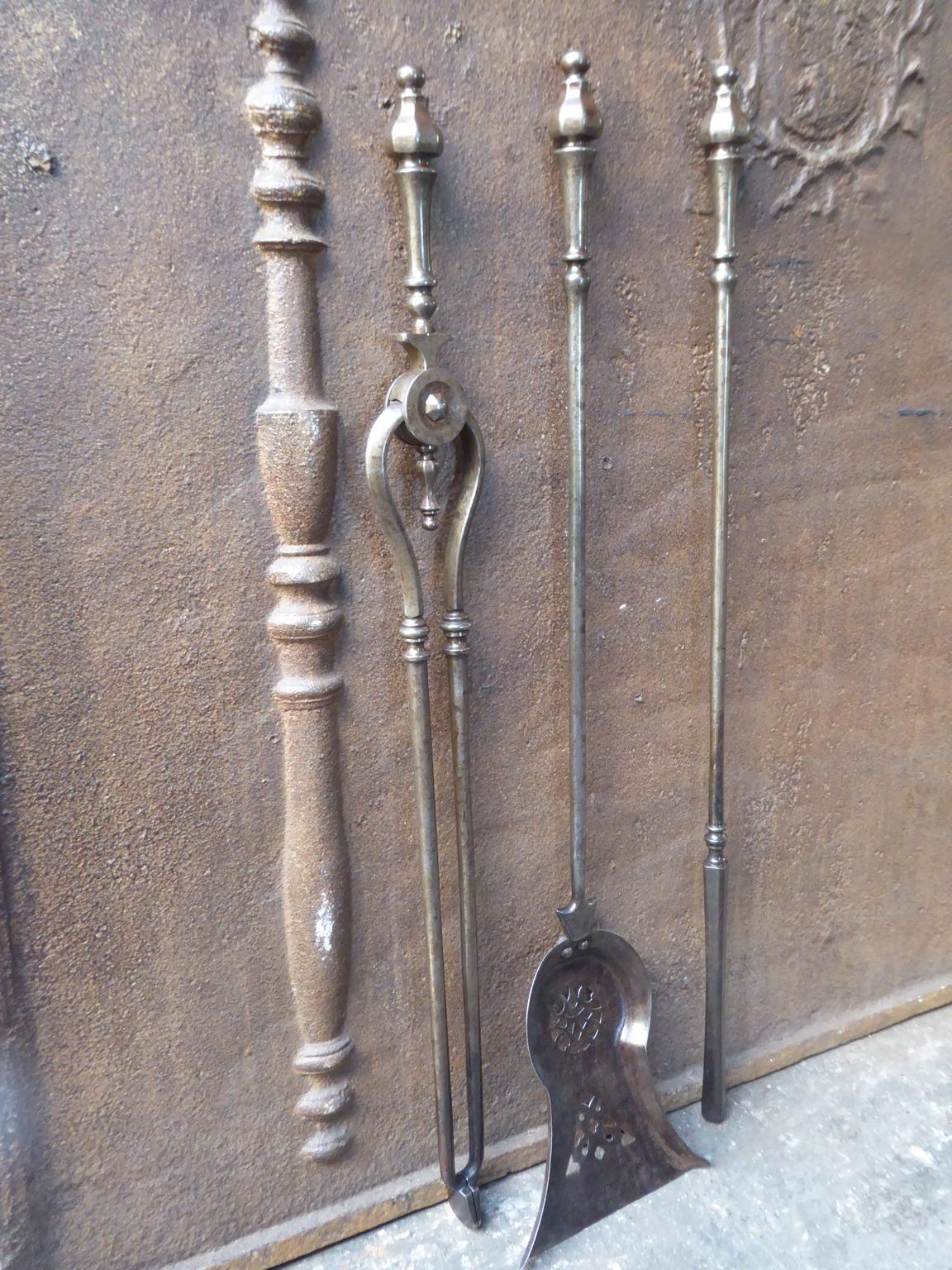 Beautiful set of three English Georgian fireplace tools made of wrought iron, 18th-19th century. The fire tool set is in a good condition and is fully functional.








   