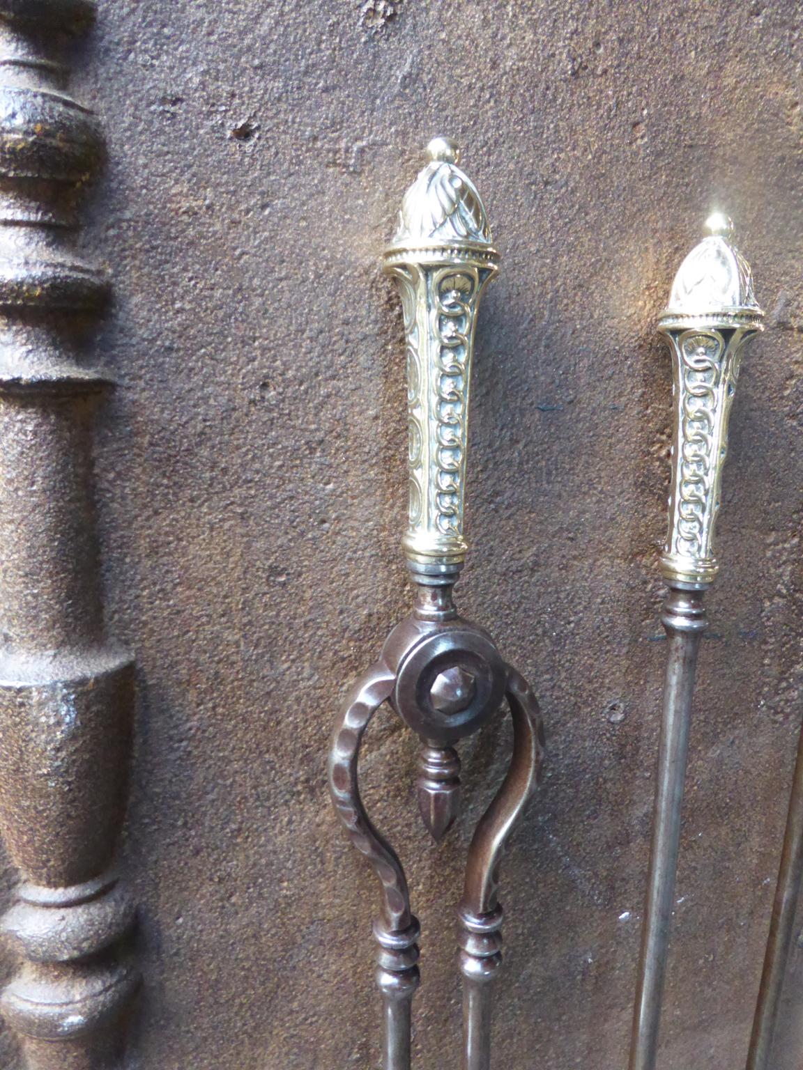 Set of three English Georgian fireplace tools made of wrought iron with polished brass handles, 18th-19th century. The fire tool set is in a good condition and is fully functional.








   