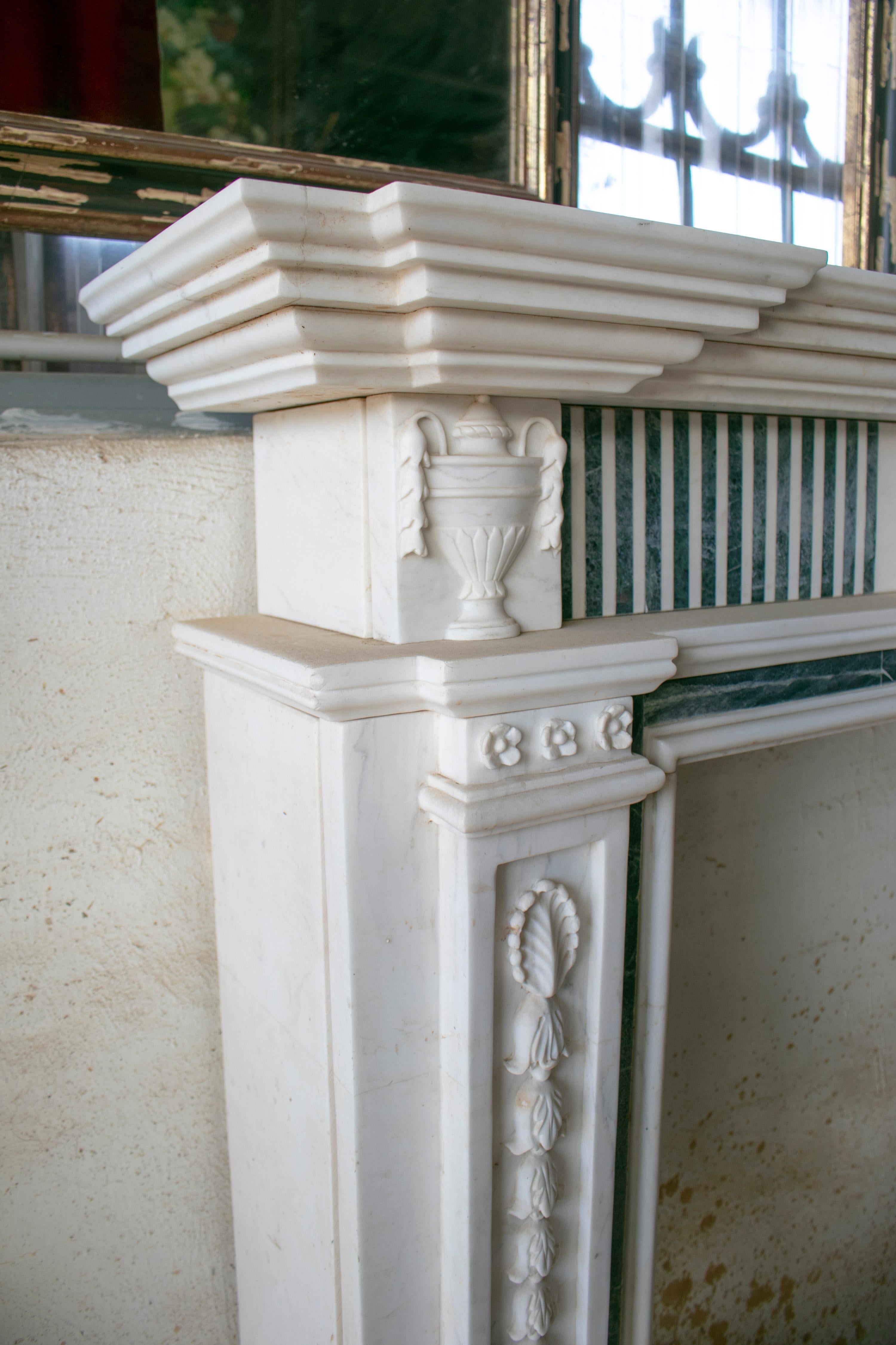 English Georgian hand carved Carrara white marble fireplace mantle with serpentine green marble inlay.
 