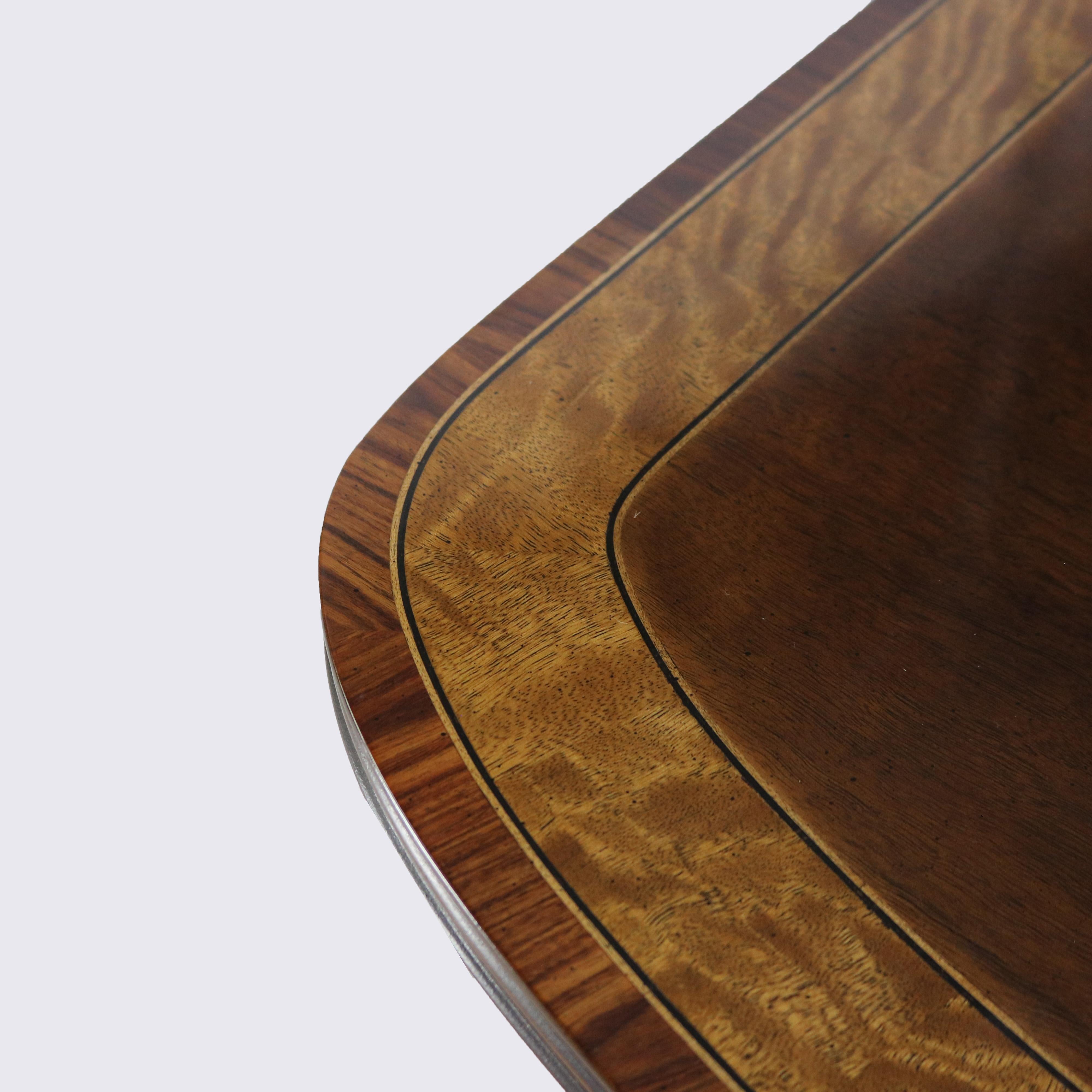***Reduced In-House Delivery Rates - Click on “Ask Seller” to Request a Quote***

English Georgian Style Cross-Banded Mahogany Double Pedestal Dining Table in the Manner of Henkel Harris with Maple Inlay, Cast Brass Claw Feet, and Two Leaves