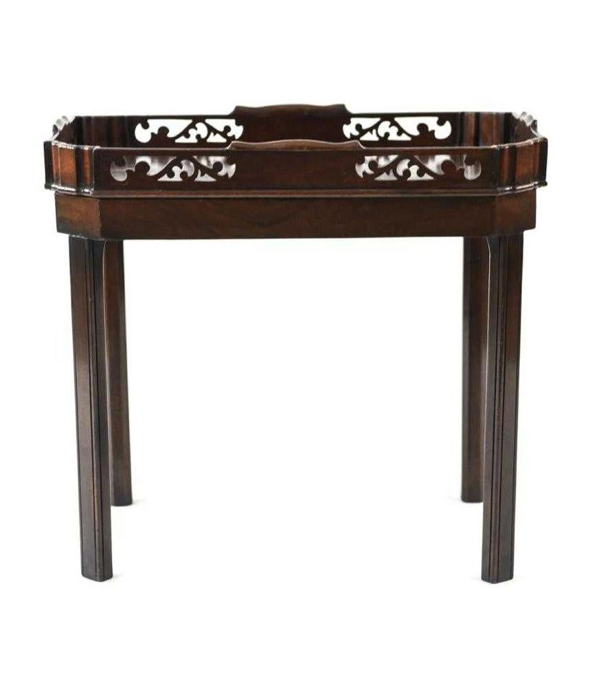 The circa 1800 English Georgian tray on contemporary base are made of solid mahogany. The tray is decorated with panels of fretwork. Perfect as a tea table, side table or occasional table.