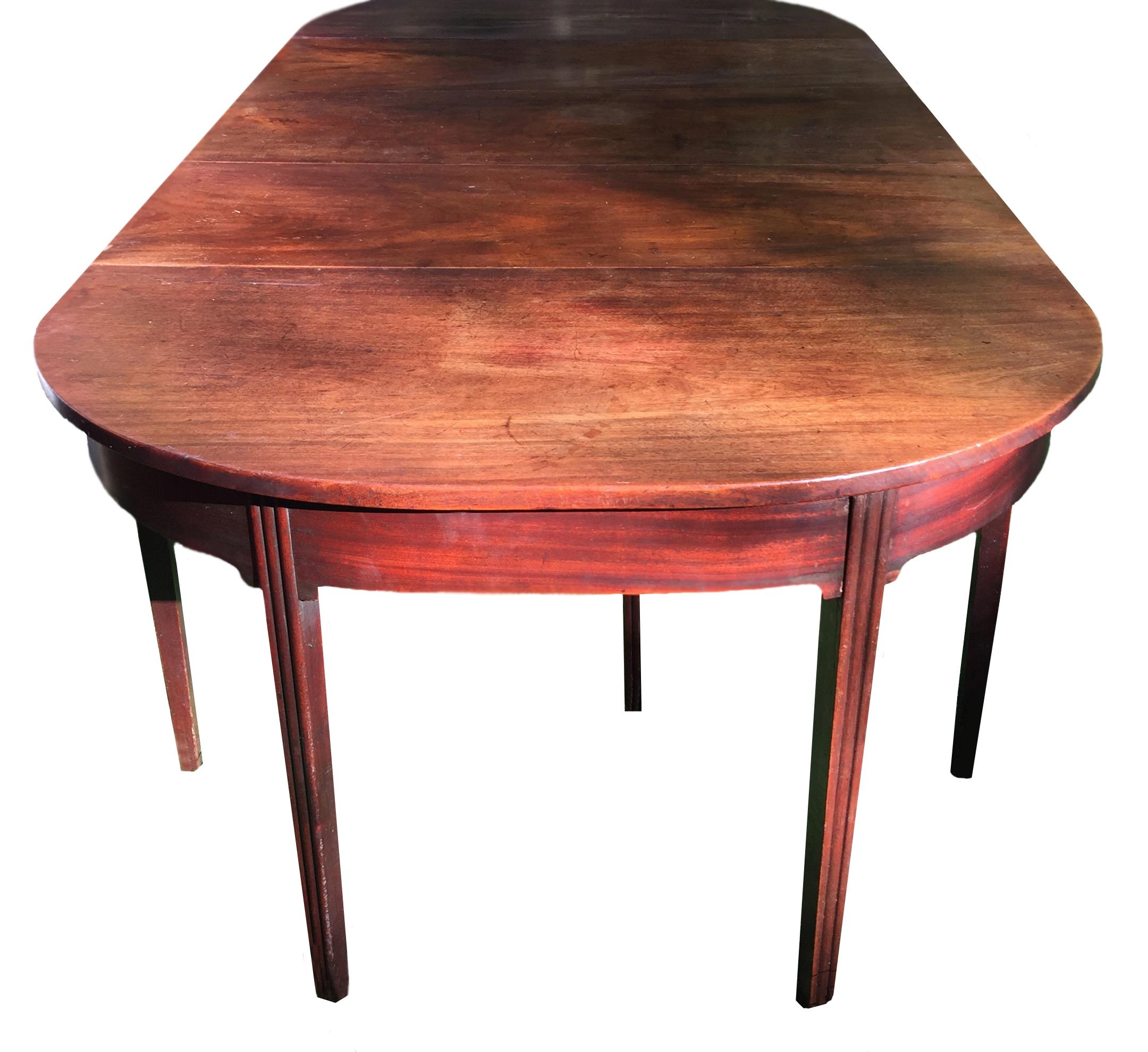 A wonderful Georgian mahogany dining table with multiple configurations. In an original condition with no apparent repairs or additions.

When not required as a dining table, it breaks down into 3 key components - the central piece with drop