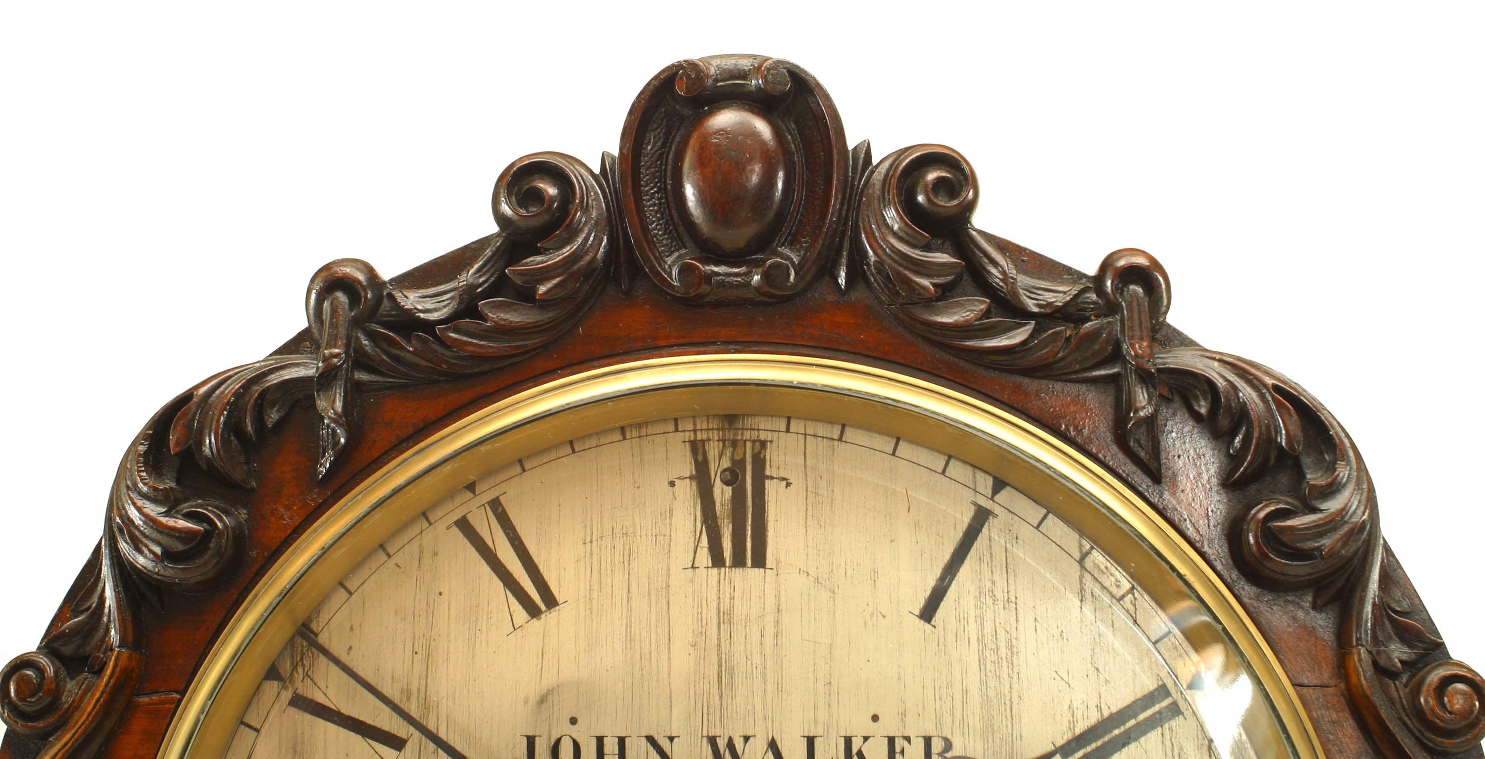 English Georgian-style (18/19th Century) large mahogany mantel clock with carved scroll design on base & round face (John Walker, 18 Cornhill, 230 Regent St., London, 1733) (Not working)

Condition: Good; Wear consistent with age and use