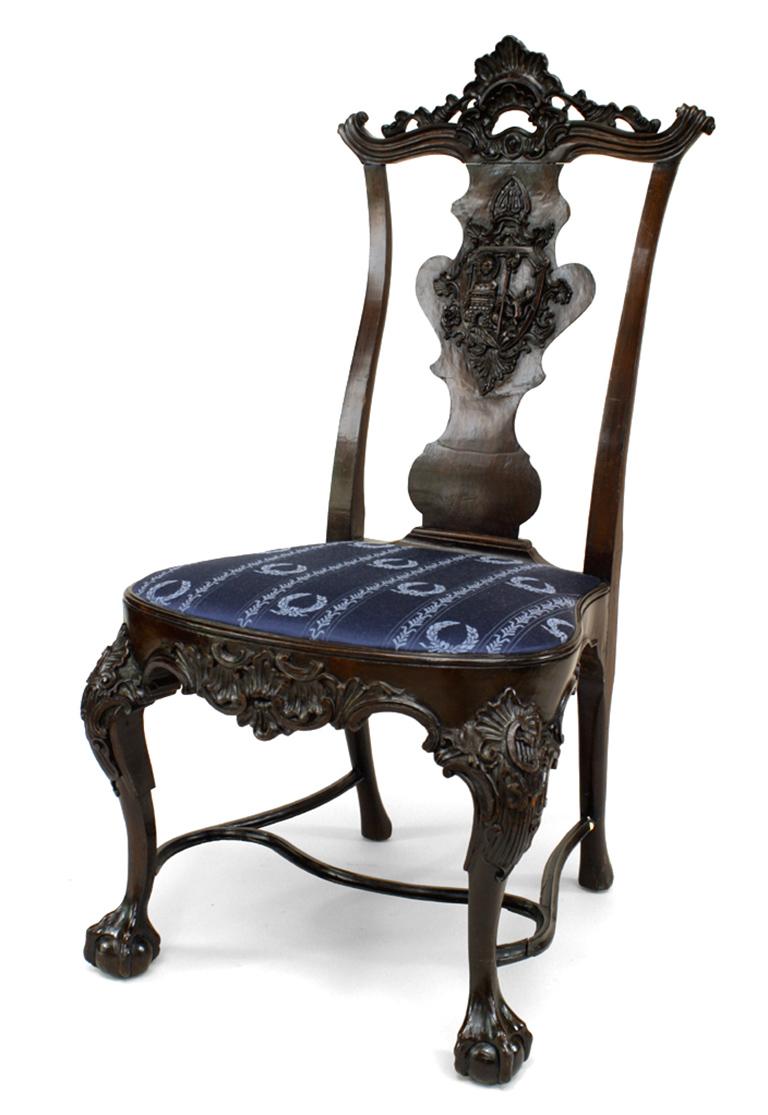 Pair of 19th century English Georgian style carved mahogany armorial splat back side chairs with slip seat and stretcher.