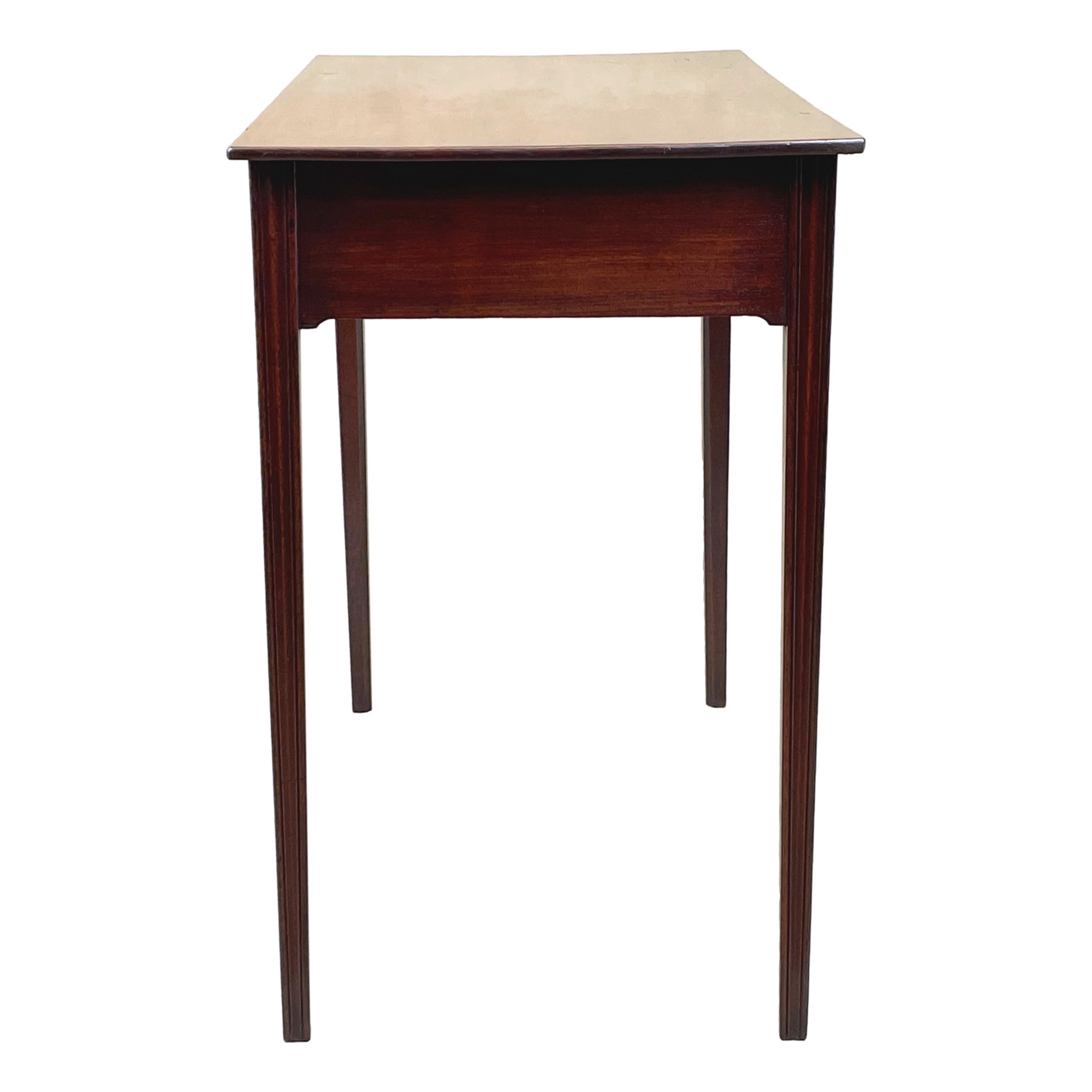 A very attractive and good quality late 18th century Georgian Mahogany side table with well figured top, over three frieze drawers retaining original brass swan neck handles and elegant shaped frieze, raised on square tapered legs.


A fabulous