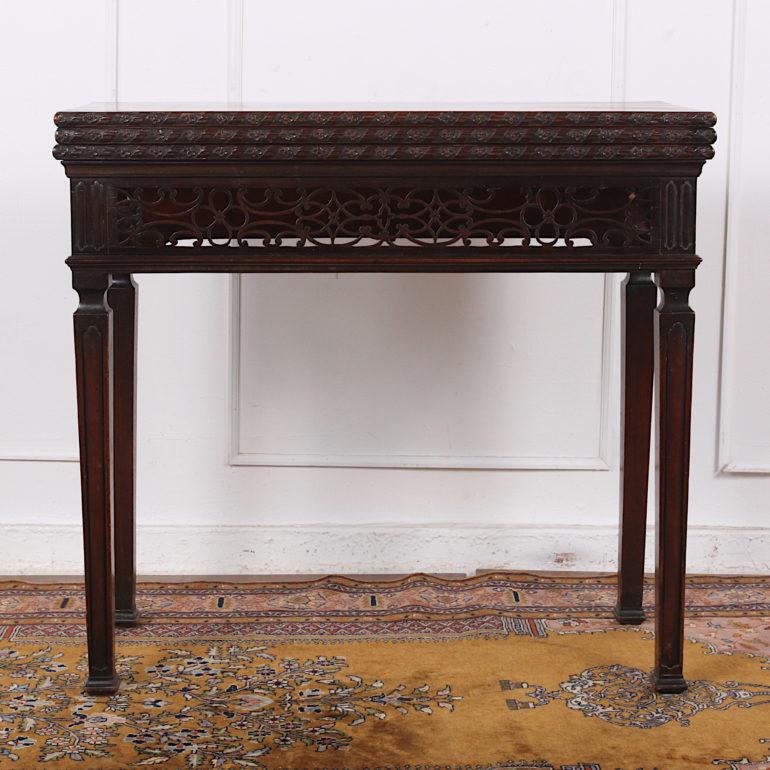 Georgian Triple-Top games\tea table in a Chinese Chippendale style, the tops allowing for alternative uses as a console, tea table or games table. Finely pierce-carved apron and shaped square-tapering legs below the three-level solid Cuban mahogany