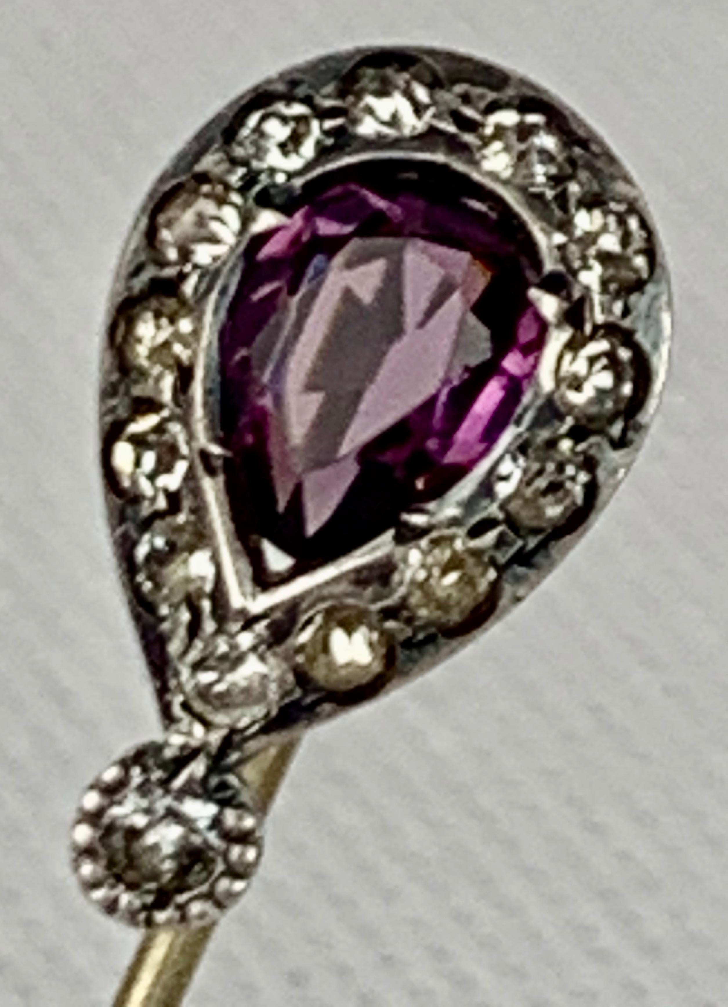 Early nineteenth century English Georgian paste stickpin with a pear shaped amethyst stone.  Originally gentlemen wore these stickpins to hold their cravats in place.  Today it is fun to wear a bit of fashion history.  They can look great on the
