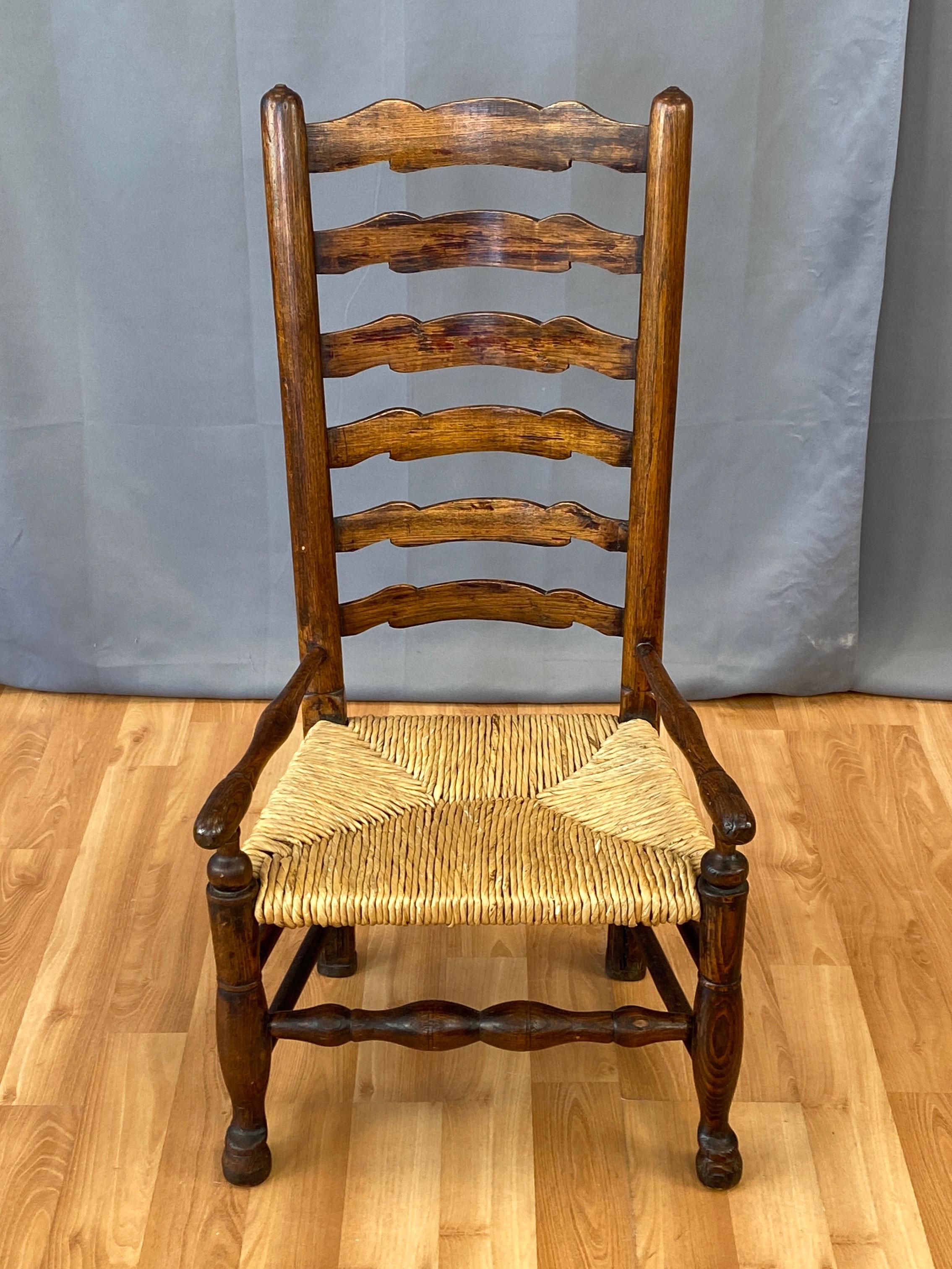 English Georgian Period Elm Ladderback Fireside Armchair with Rush Seat, c. 1800 For Sale 1