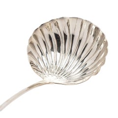 English Georgian shell form ladle in sterling silver, c. 1700's