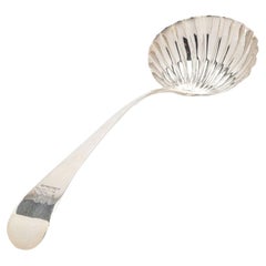 English Georgian shell form ladle in sterling silver, c. 1700's