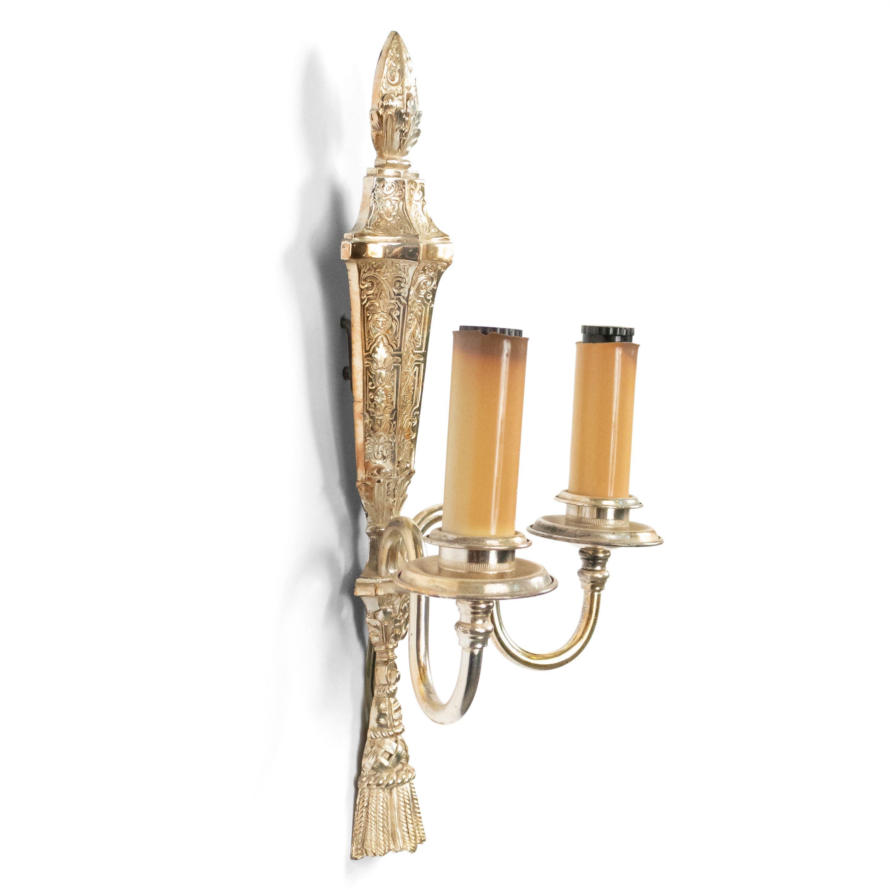 Pair of English Georgian style (19th-20th century) silver plate etched 2-arm wall sconces with tassel bottom and finial top. (Caldwell).