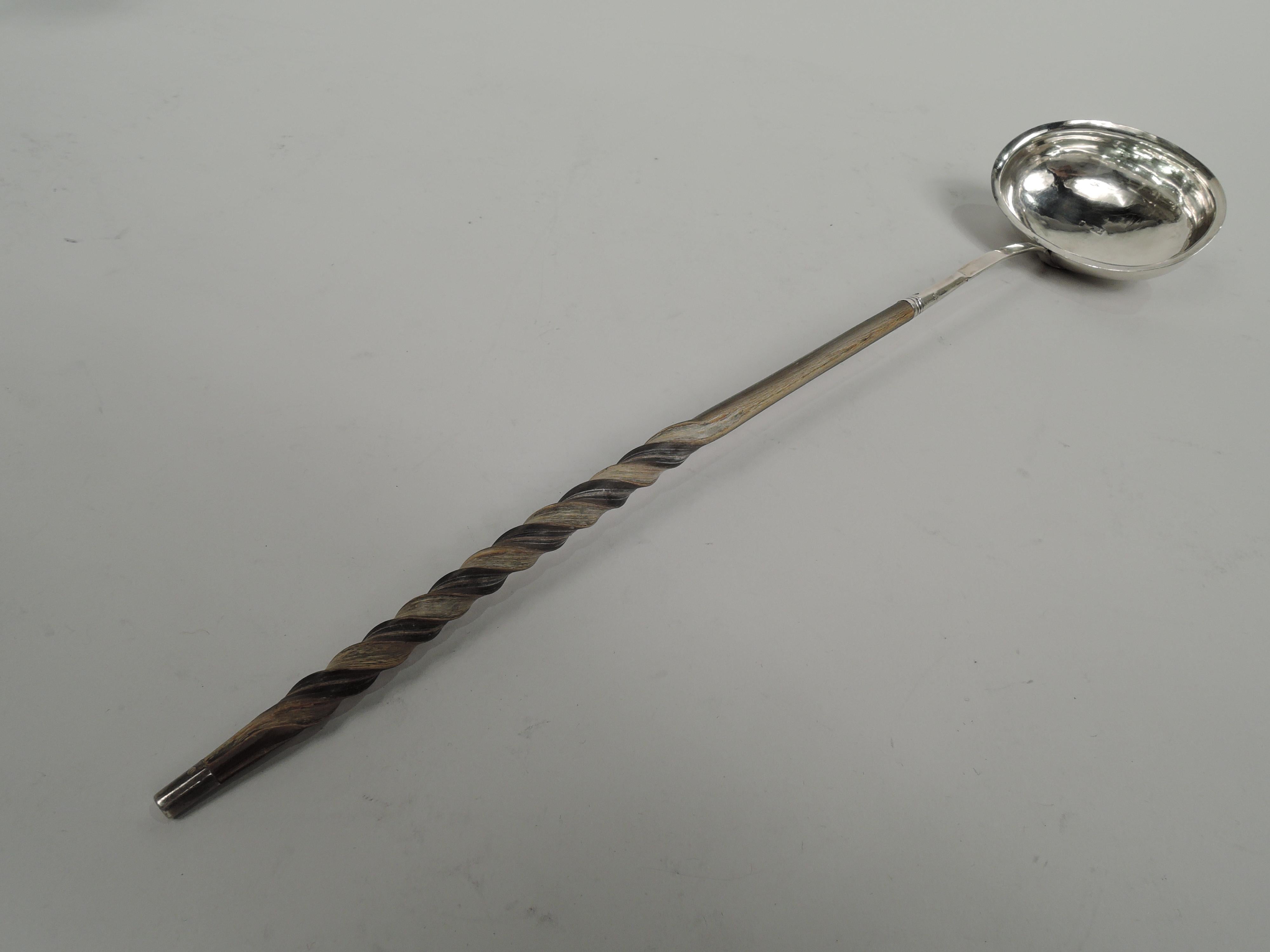 English Georgian sterling siler ladle with oval bowl; twisted baleen handle with sterling silver terminal. Worn marks including maker’s initials TM (possibly Thomas Mynd).