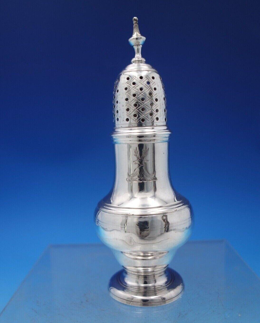 English Georgian sterling silver salt and pepper shaker two-piece set made in London circa 1788 (worn marks/maker unknown). This set features engraved lids and has an animal engraving (see photos). The shakers measure 5