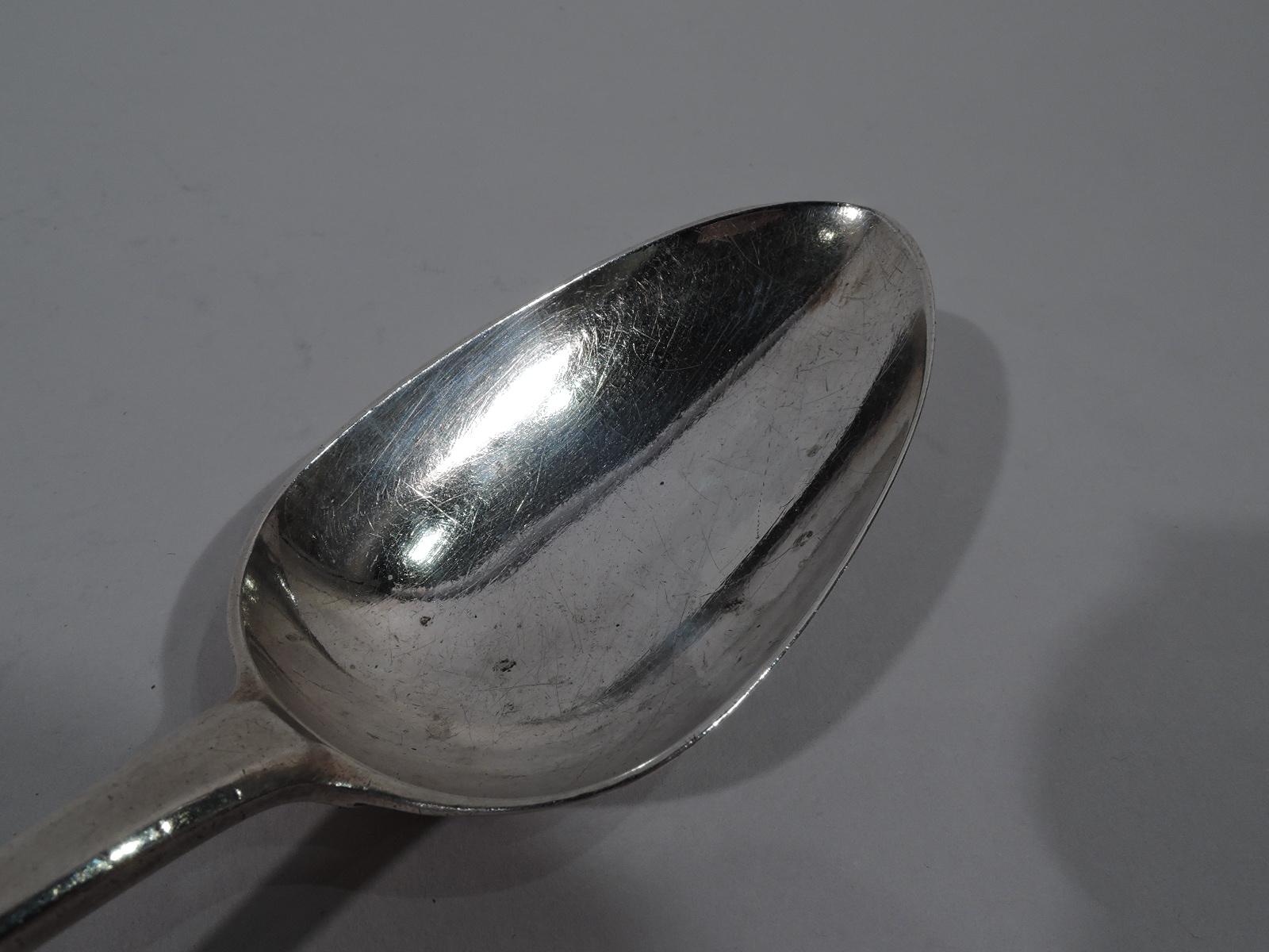 George III sterling silver stuffing spoon. Made by Hester Bateman in London in 1782. Tapering handle and Hanoverian terminal engraved with interlaced script monogram, and oval bowl. A great piece by the noted Georgian silversmith. Weight: 3 troy