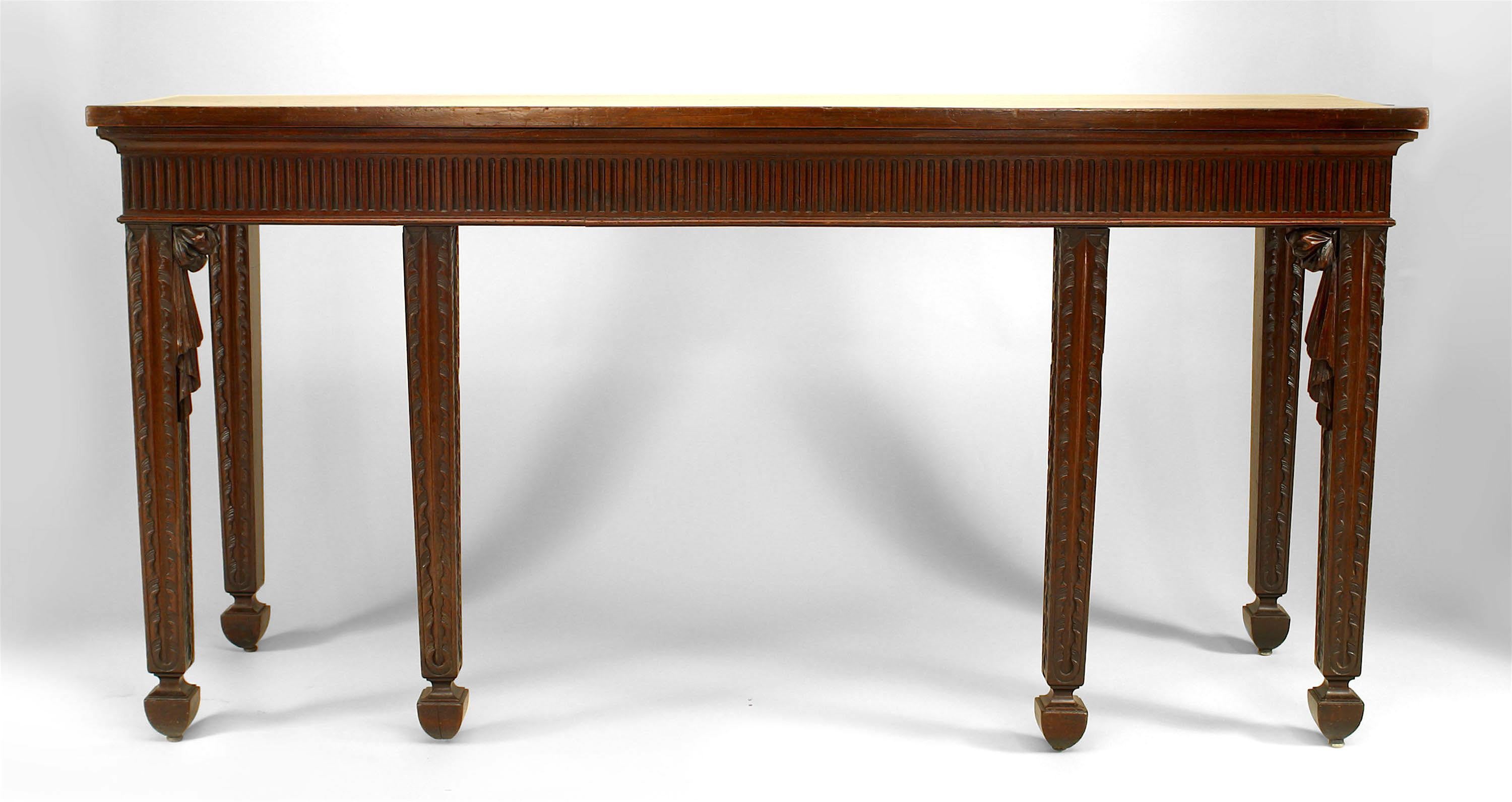 English Georgian style (19th century) mahogany six legged console table with carved drape corners.
 