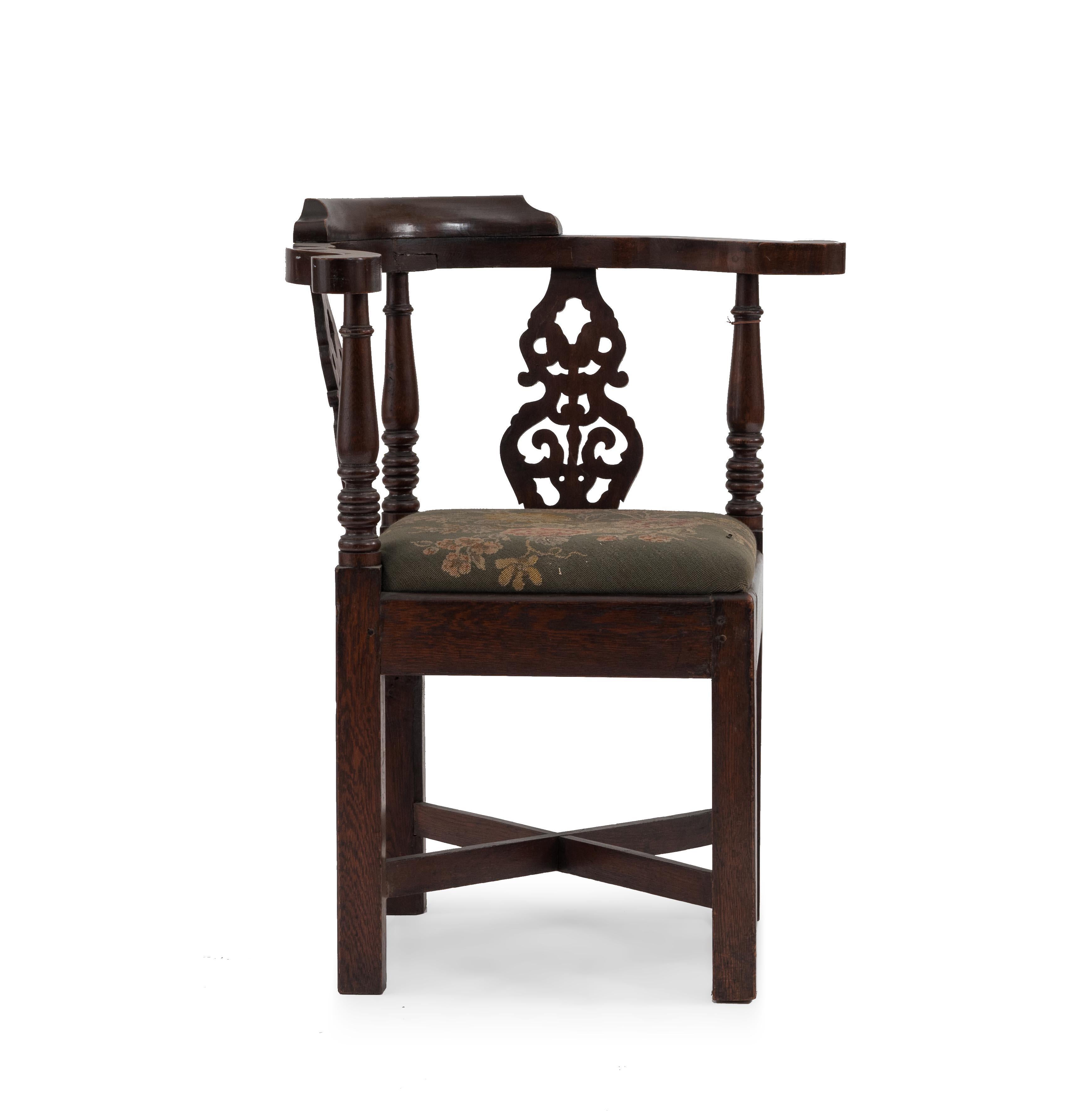 English Georgian-style (19th Century) oak corner armchair with filigree splat back and needlepoint seat.
