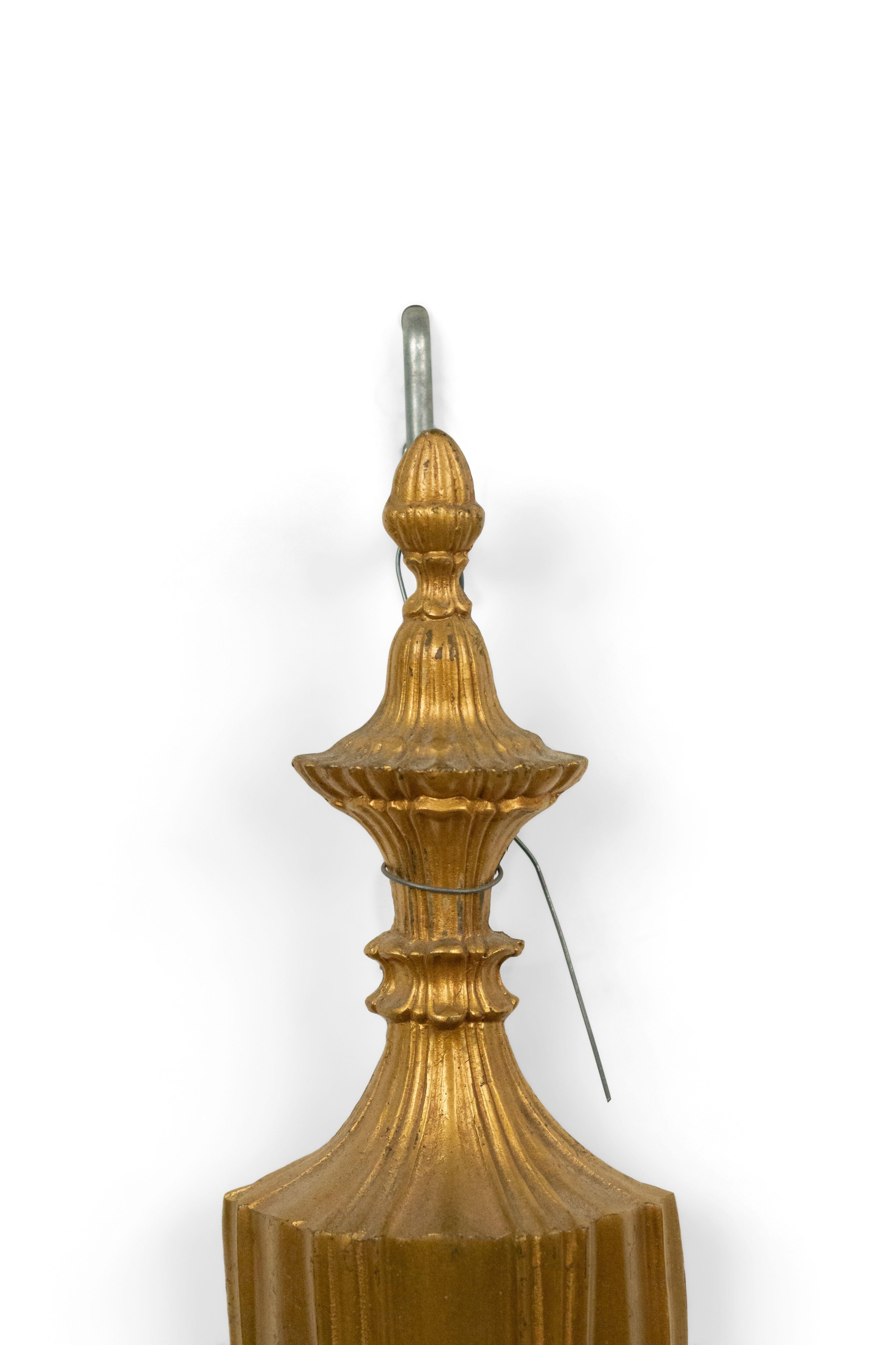 3 English Georgian style brass 2 arm wall sconces with fluted vasiform backplate, (20th Century).