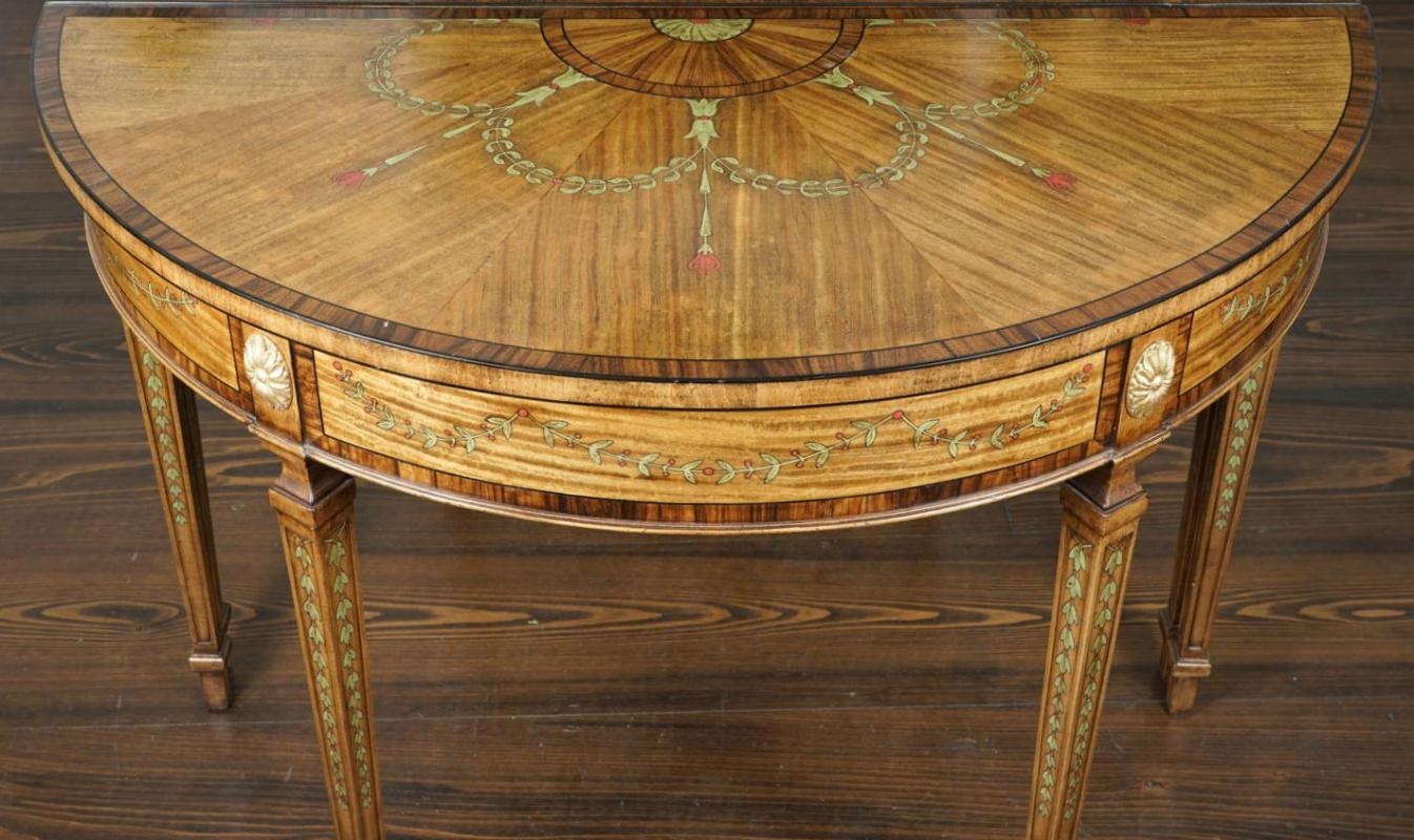 Demilune shaped mahogany and fruitwood console table in the English Georgian style with fine parquetry and marquetry inlay.