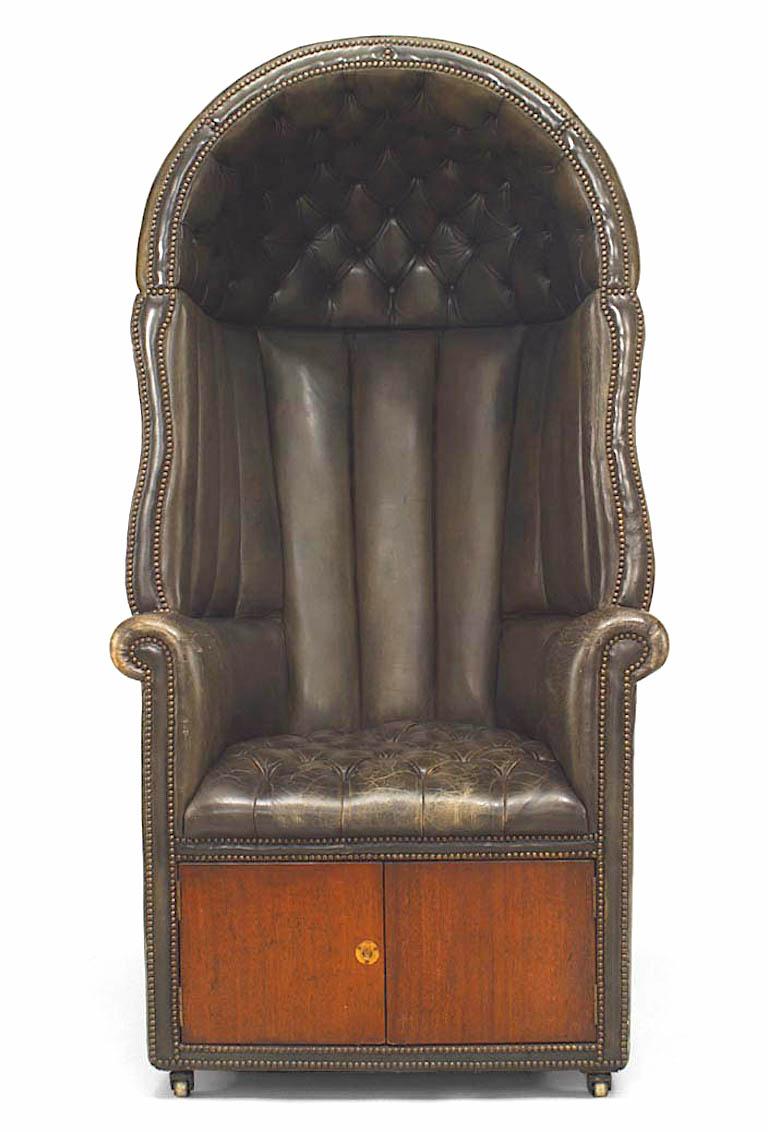 English Georgian style draft arm chair upholstered in tufted green leather with hood above wings & a seat over 2 doors (late 19th/early 20th Cent)
