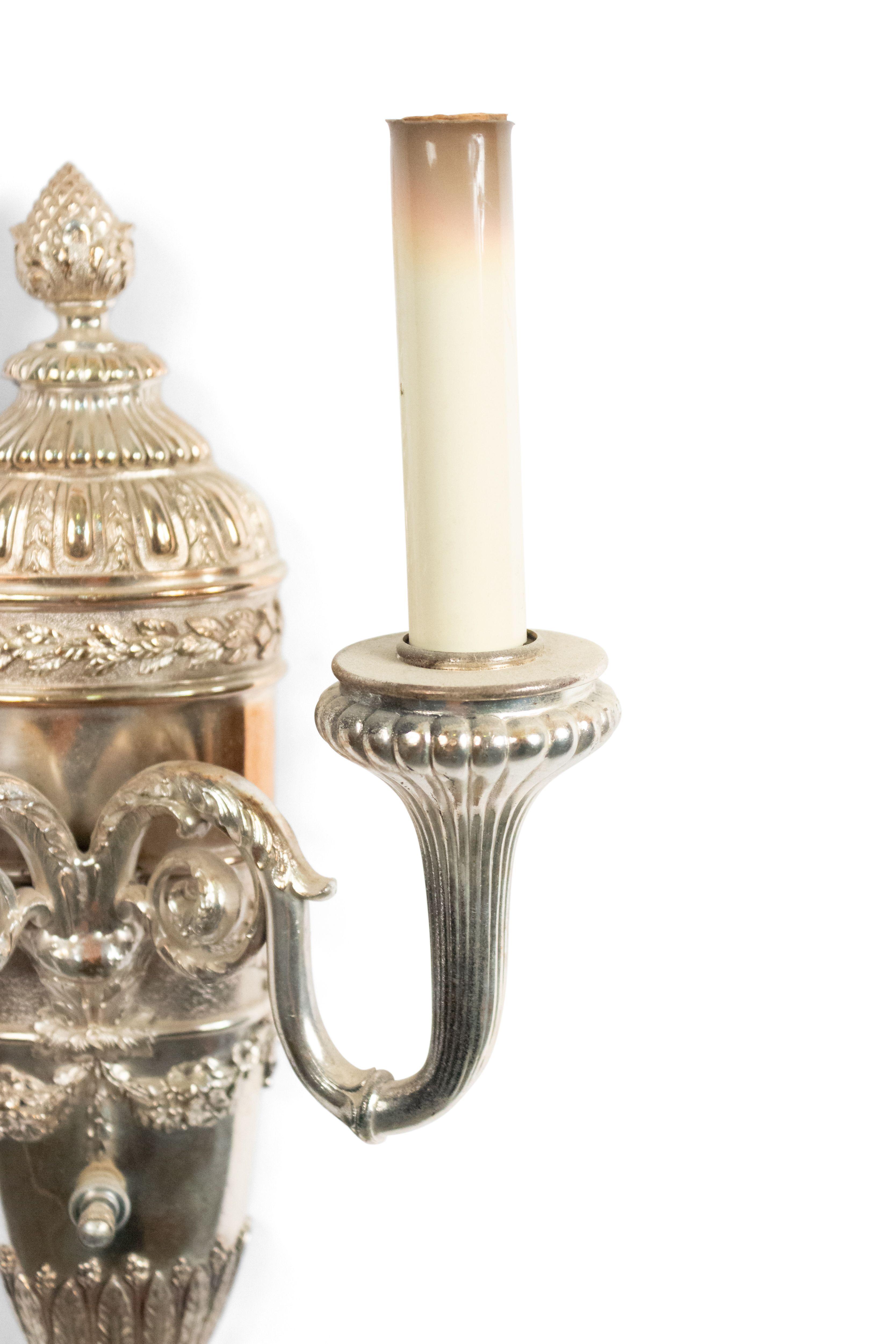 Pair of English Georgian style 19th century silver plate fluted arm wall sconces with acorn finial and swag and tassel at bottom.