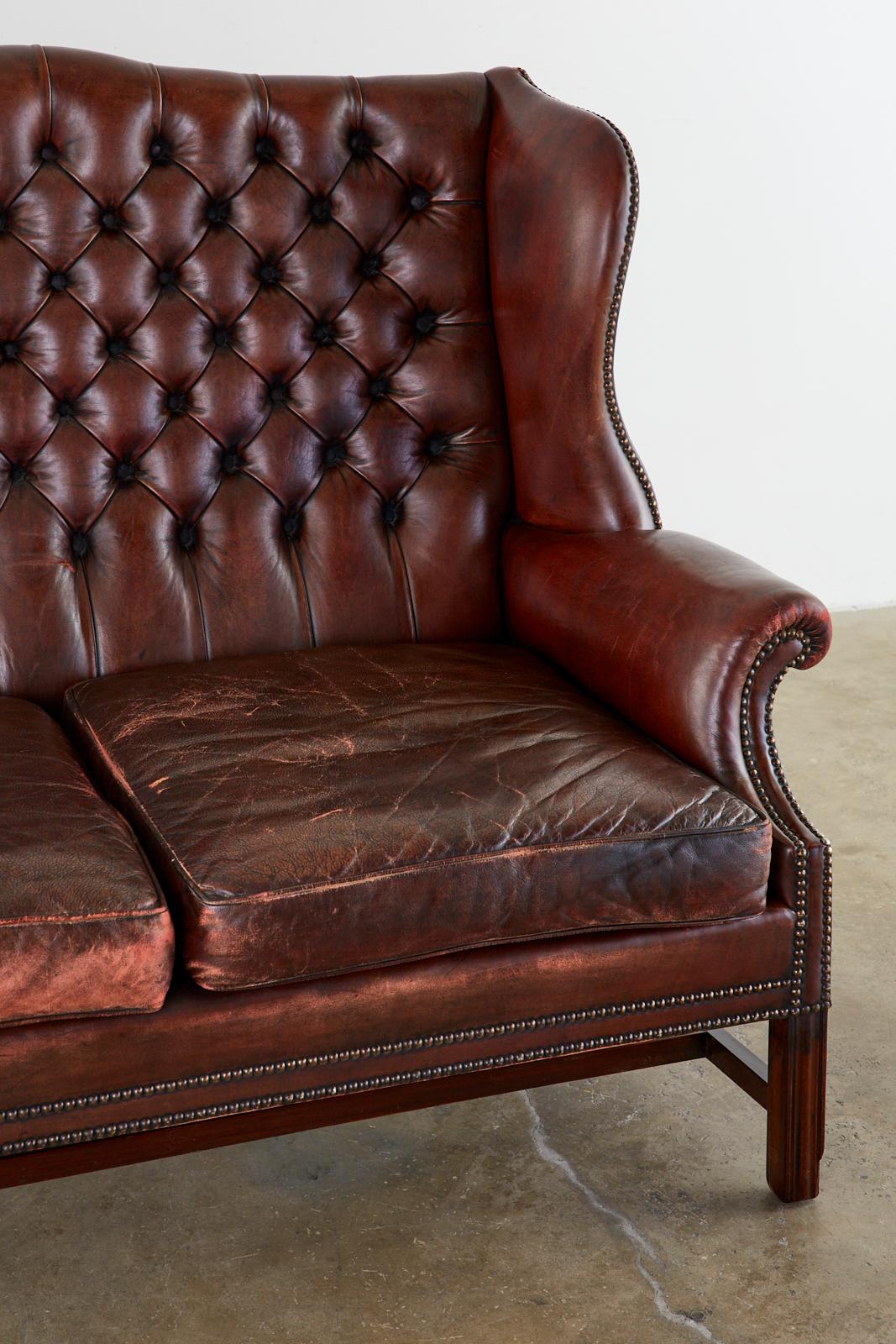 20th Century English Georgian Style Tufted Leather Chesterfield Wingback Settee