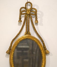 English Georgie III Oval Carved Rope and Tassel Giltwood Mirror, circa 1830