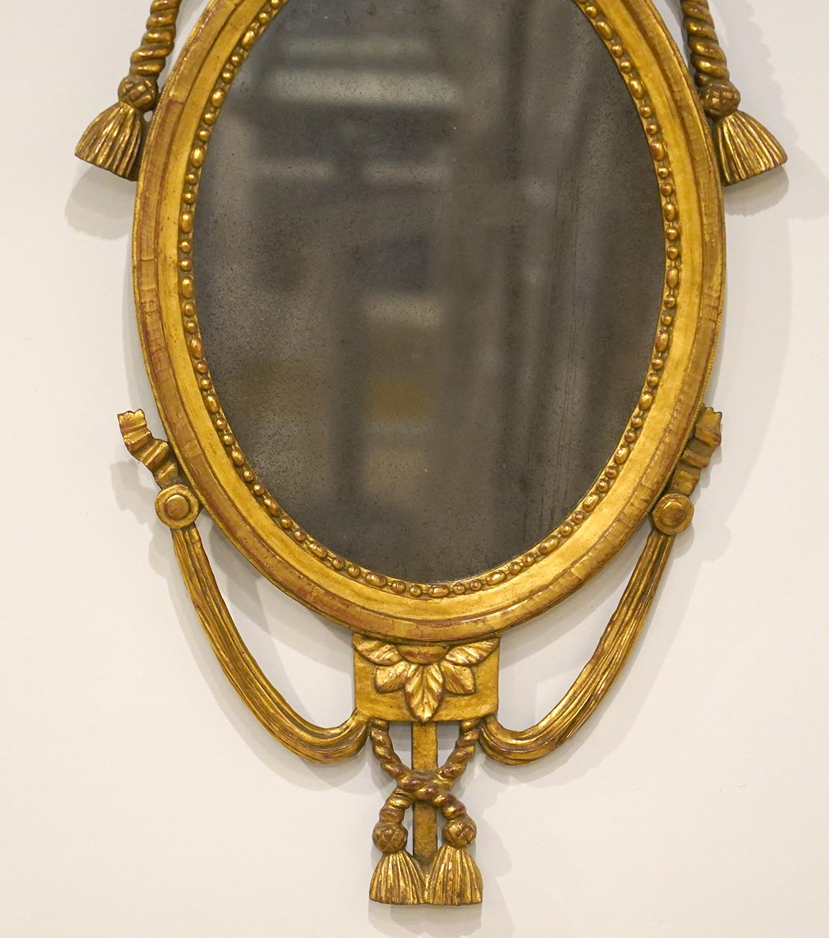 George III English Georgie III Oval Carved Rope and Tassel Giltwood Mirror, circa 1830
