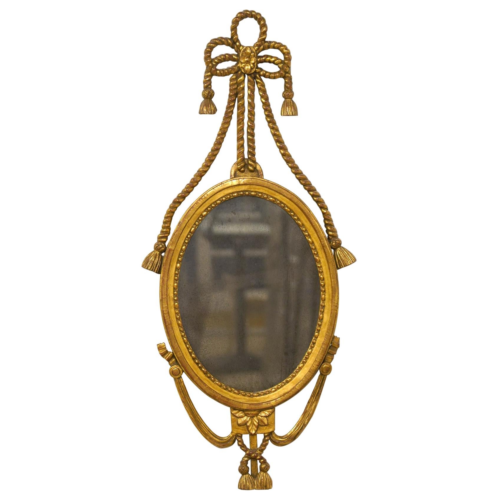 English Georgie III Oval Carved Rope and Tassel Giltwood Mirror, circa 1830