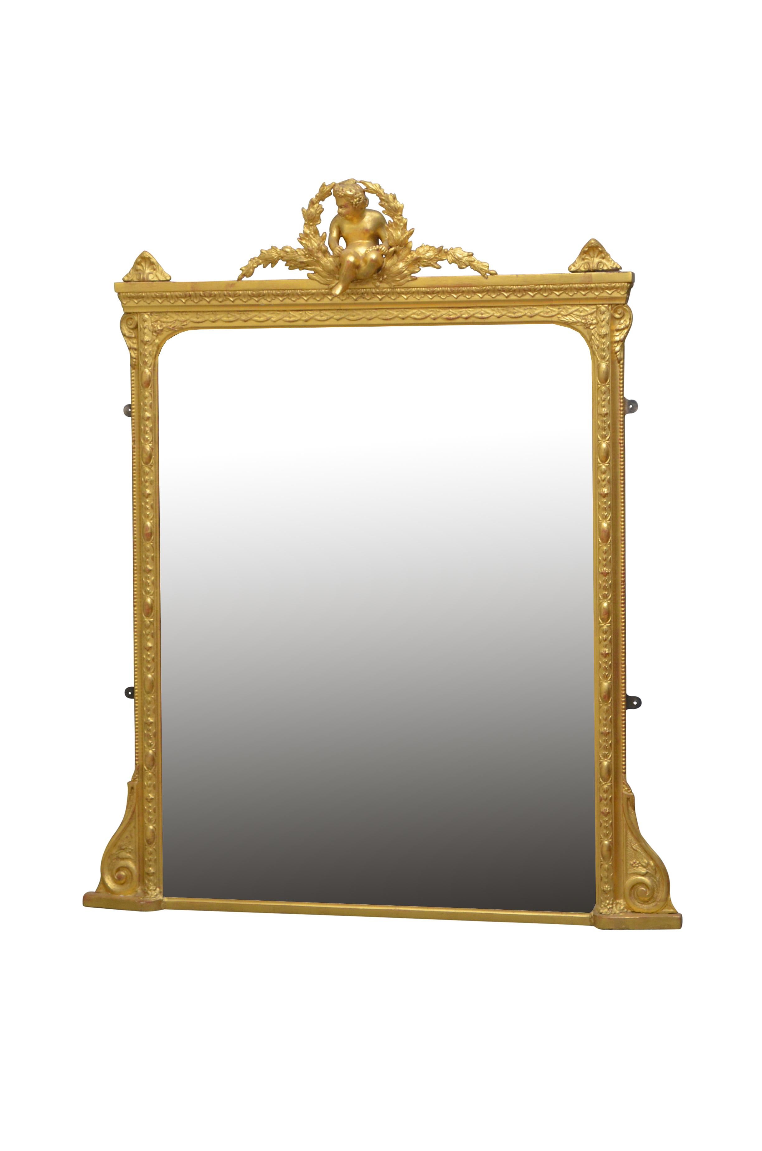 K0403 Victorian revival giltwood overmntle wall mirror with original bevelled edge glass (with small air bubbles throughout) in carved frames with cherub to centre and fine scrolls to base. This mirror retains its original glass with air bubbles and