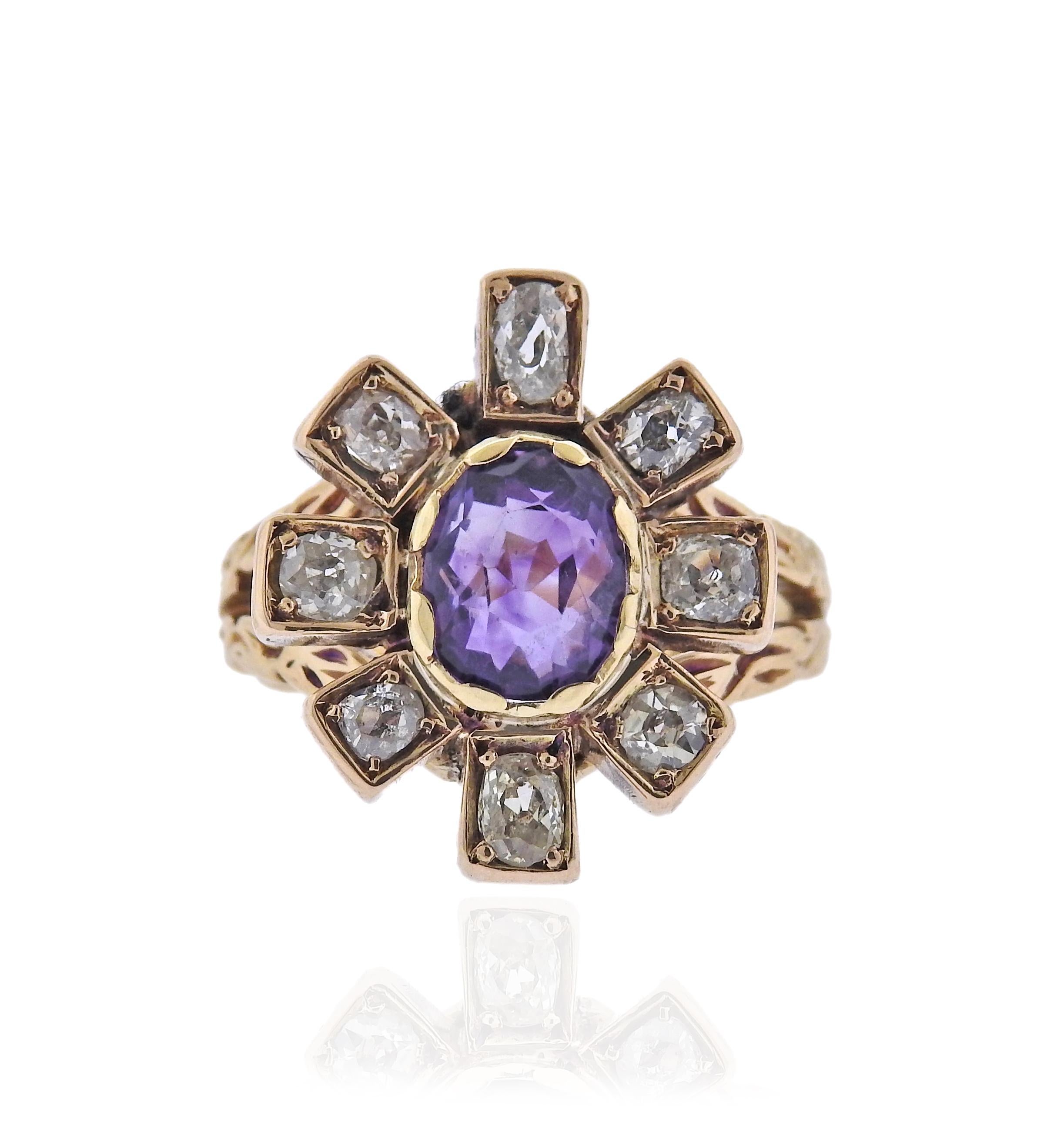 English made 18k gold ring, with center 8 6.3mm amethyst and approx. 0.90ctw old mine cut diamonds. Ring size 6.25 (EU 52), top is 19 x 16mm. Marked with English gold marks. Weight 7.6 grams.