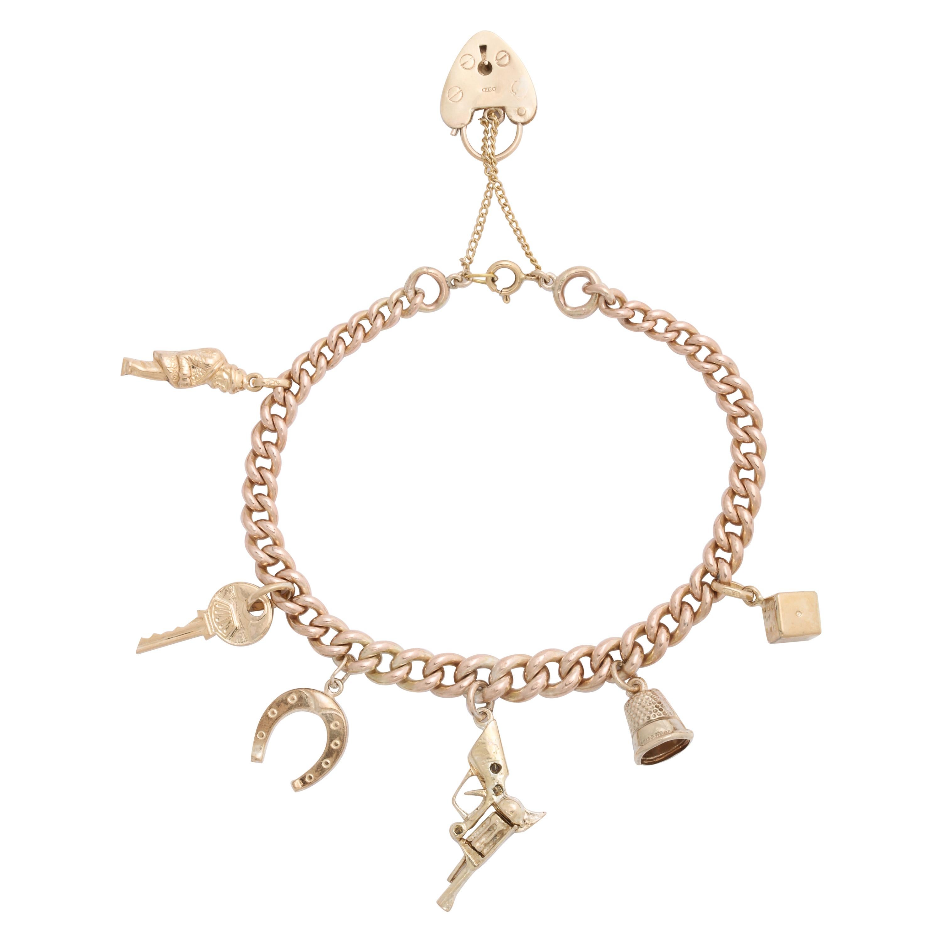 English 18k and 9k Gold Charm Bracelet, Birmingham, 1950s